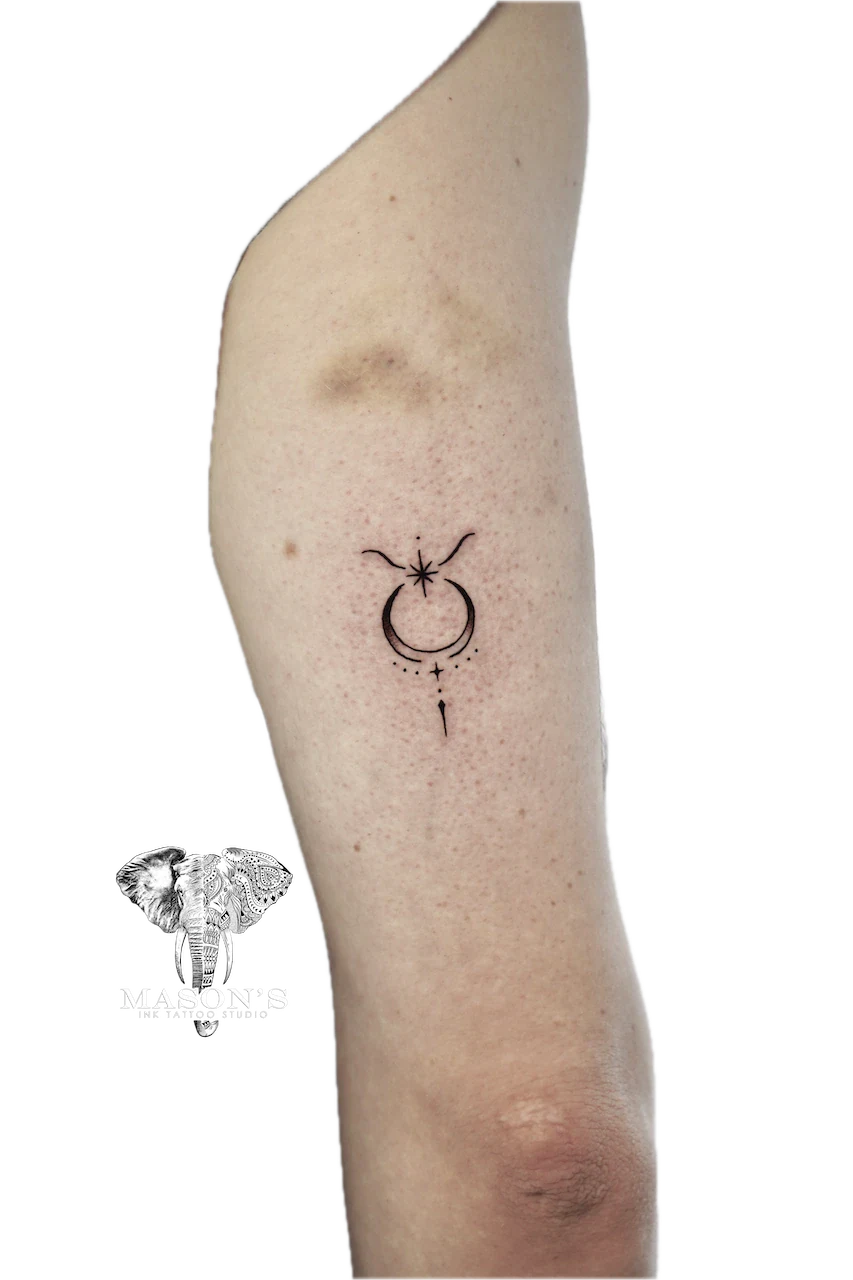 Fine Line Tattoo Design: Minimalist moon and stars tattoo on the thigh