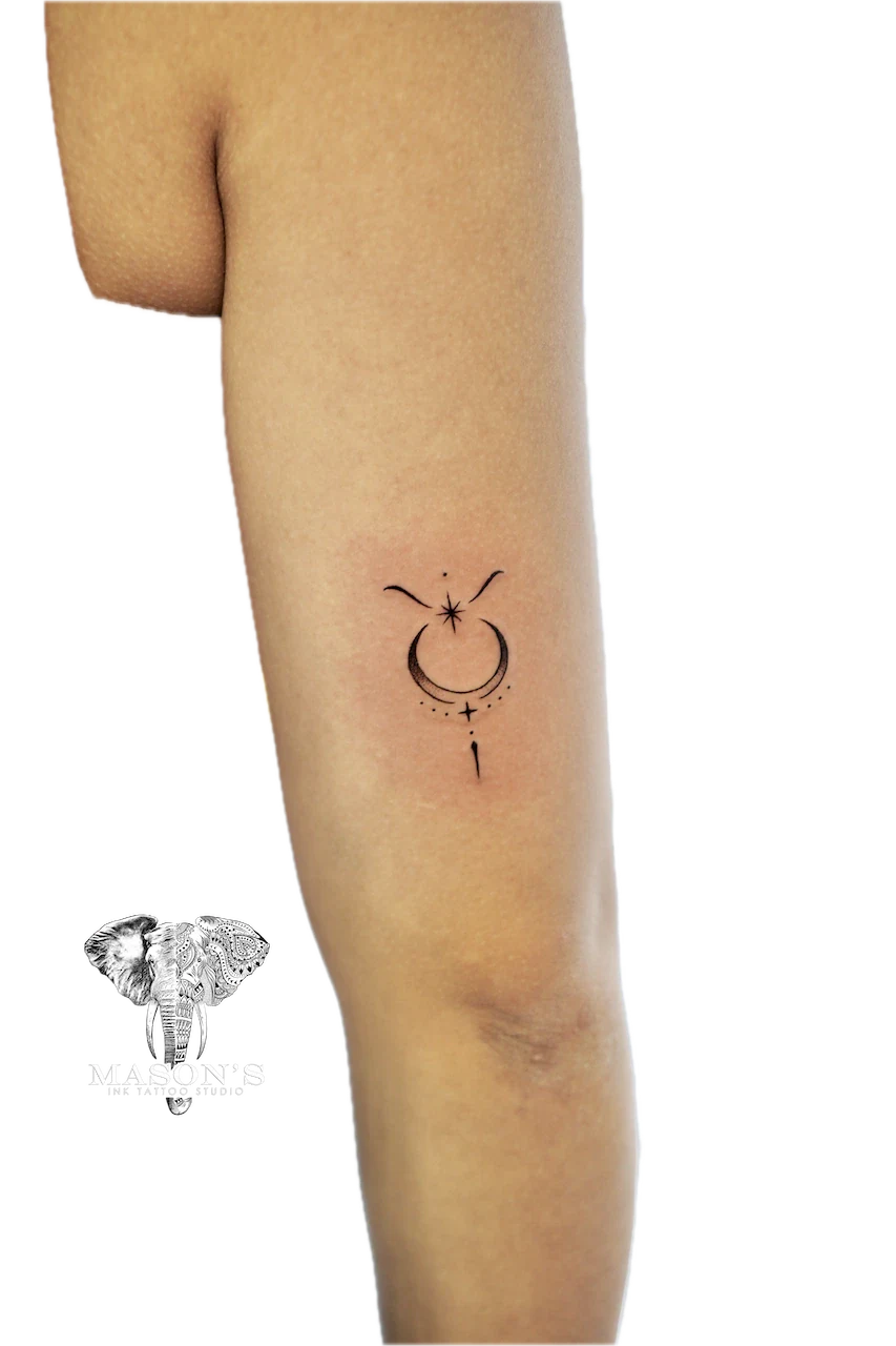 Fine Line Tattoo Design: a minimalist moon and stars tattoo with an arrow on a forearm