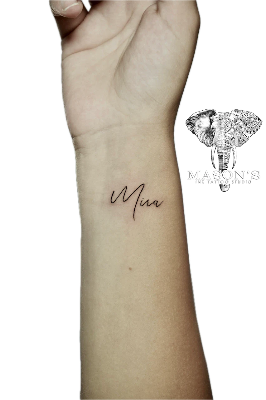 Fine Line Tattoo Design: a small forearm tattoo of the name 'Mira' in cursive