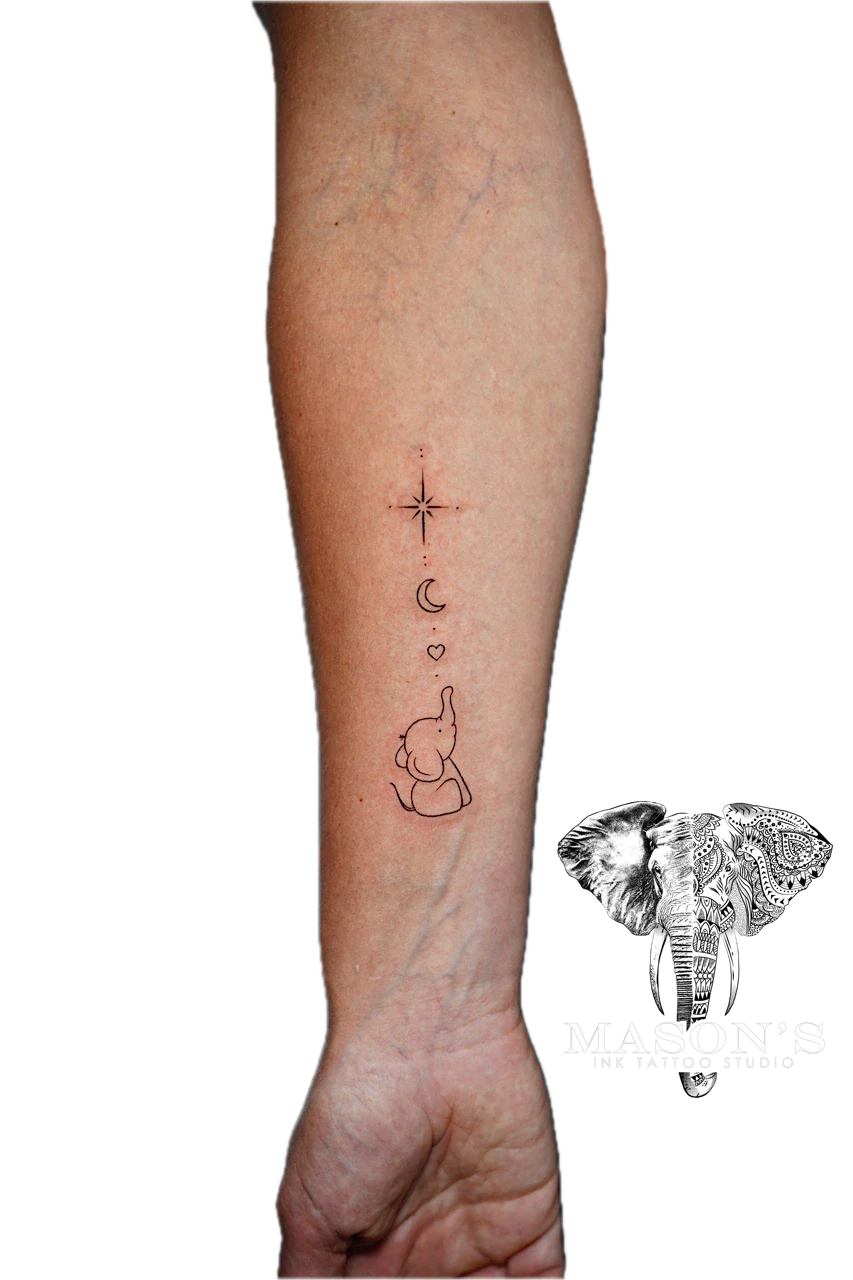 Fine Line Tattoo Design: a minimalist calf tattoo with an elephant, moon, heart, and star