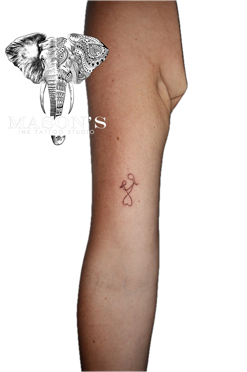 Fine Line Tattoo Style: Small red heart with ribbon on calf