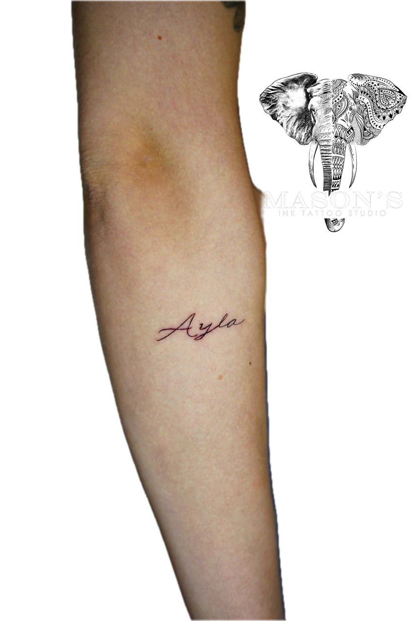 Fine Line Tattoo Style: a small script tattoo of the name Ayla on the calf