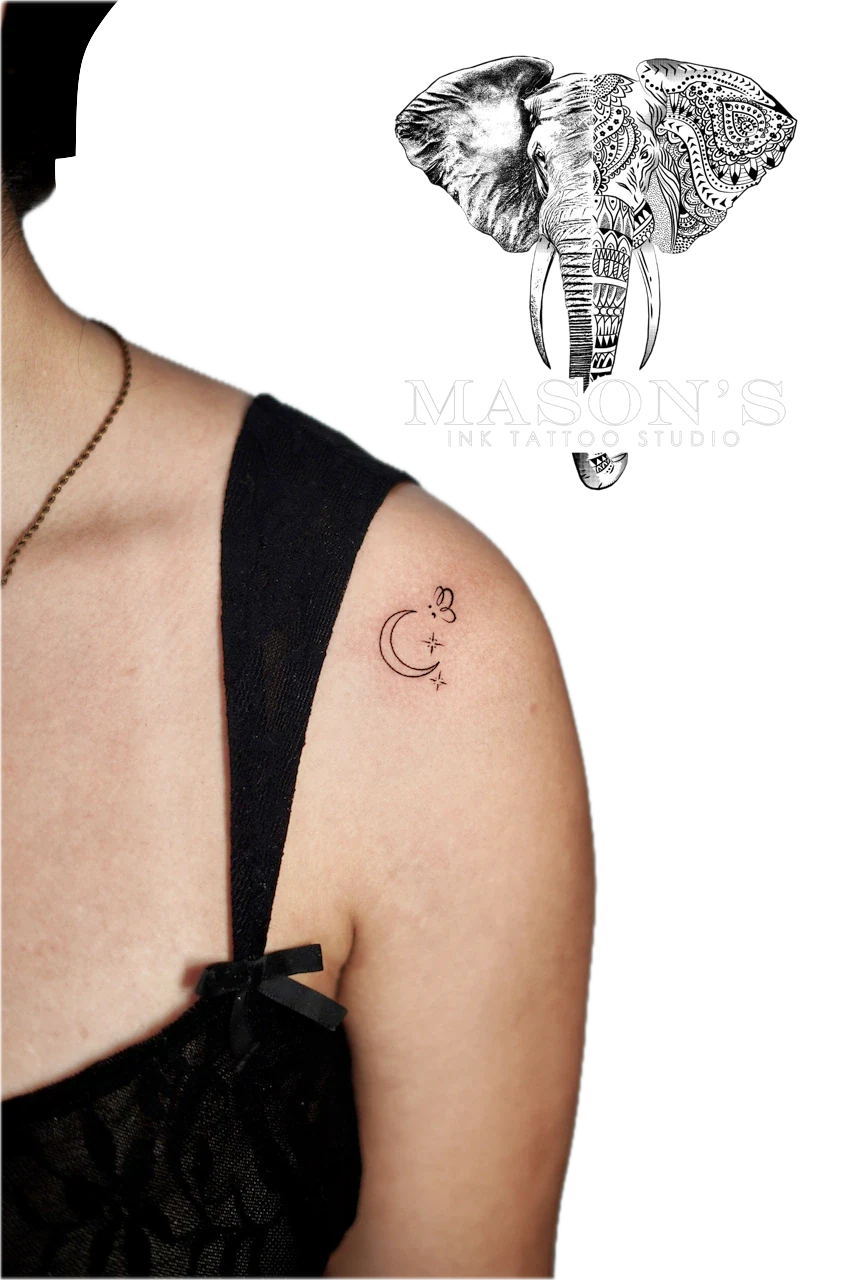 Fine Line Tattoo Style Moon and Star: Minimalist moon and lettering tattoo on upper arm