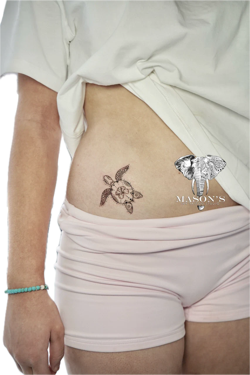 Fine Line Turtle Tattoo Design: Two small animal tattoos on the stomach
