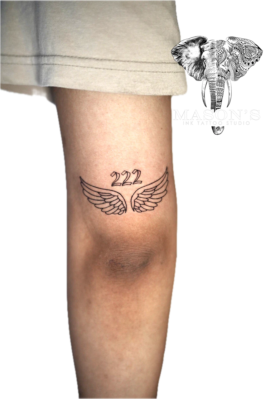 Fine Line Wings and Script Tattoo Design: Minimalistic angel wings with number 222 on the knee