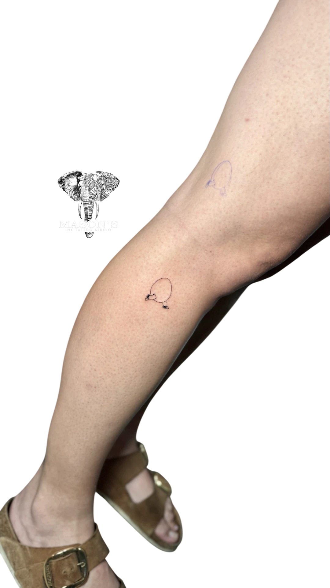 Fine Line Egg Tattoo with Foot by Mason's Ink Tattoo Studio, Bali