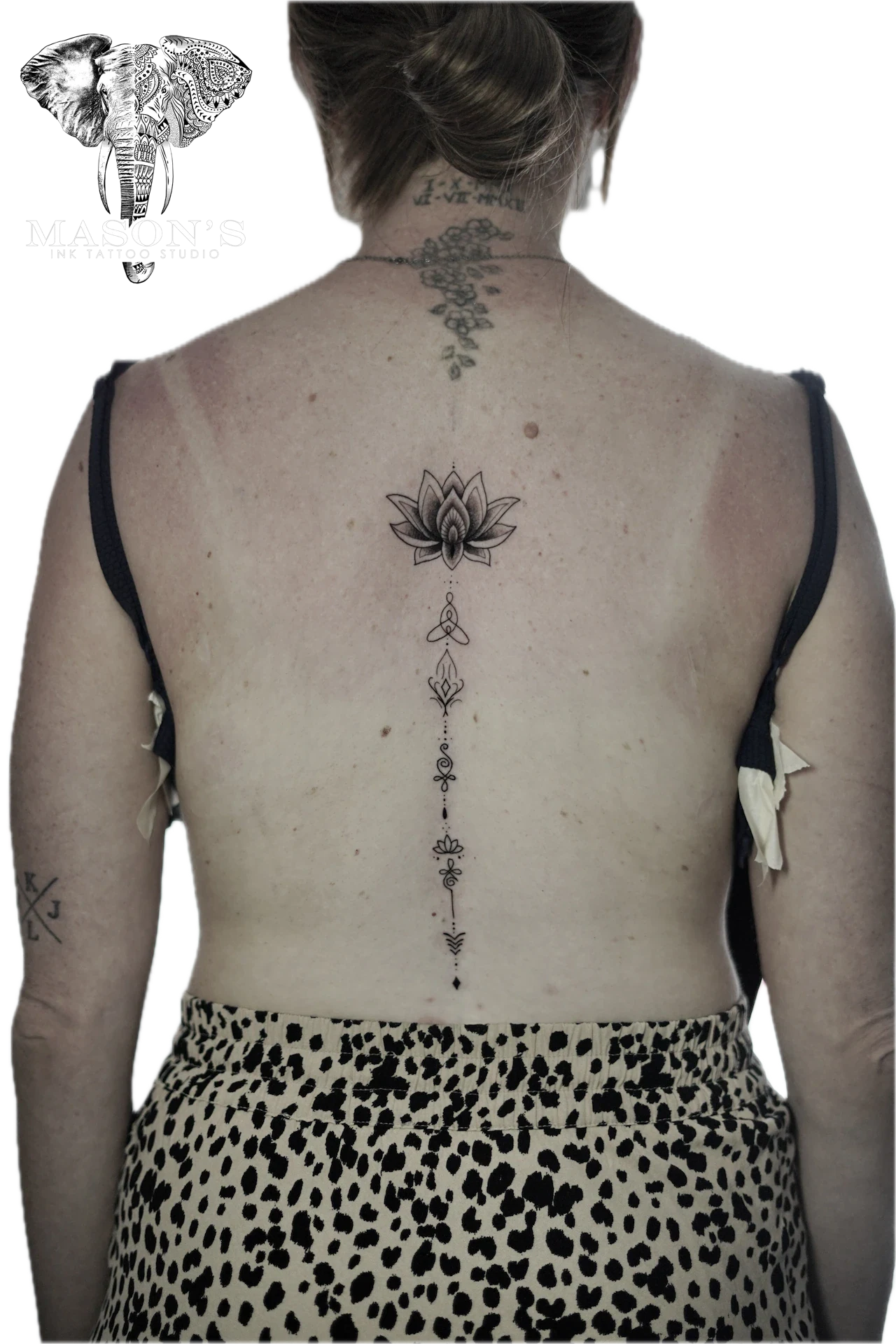 Fine Line Lotus on back Tattoo by Mason's Ink Tattoo Studio, Bali
