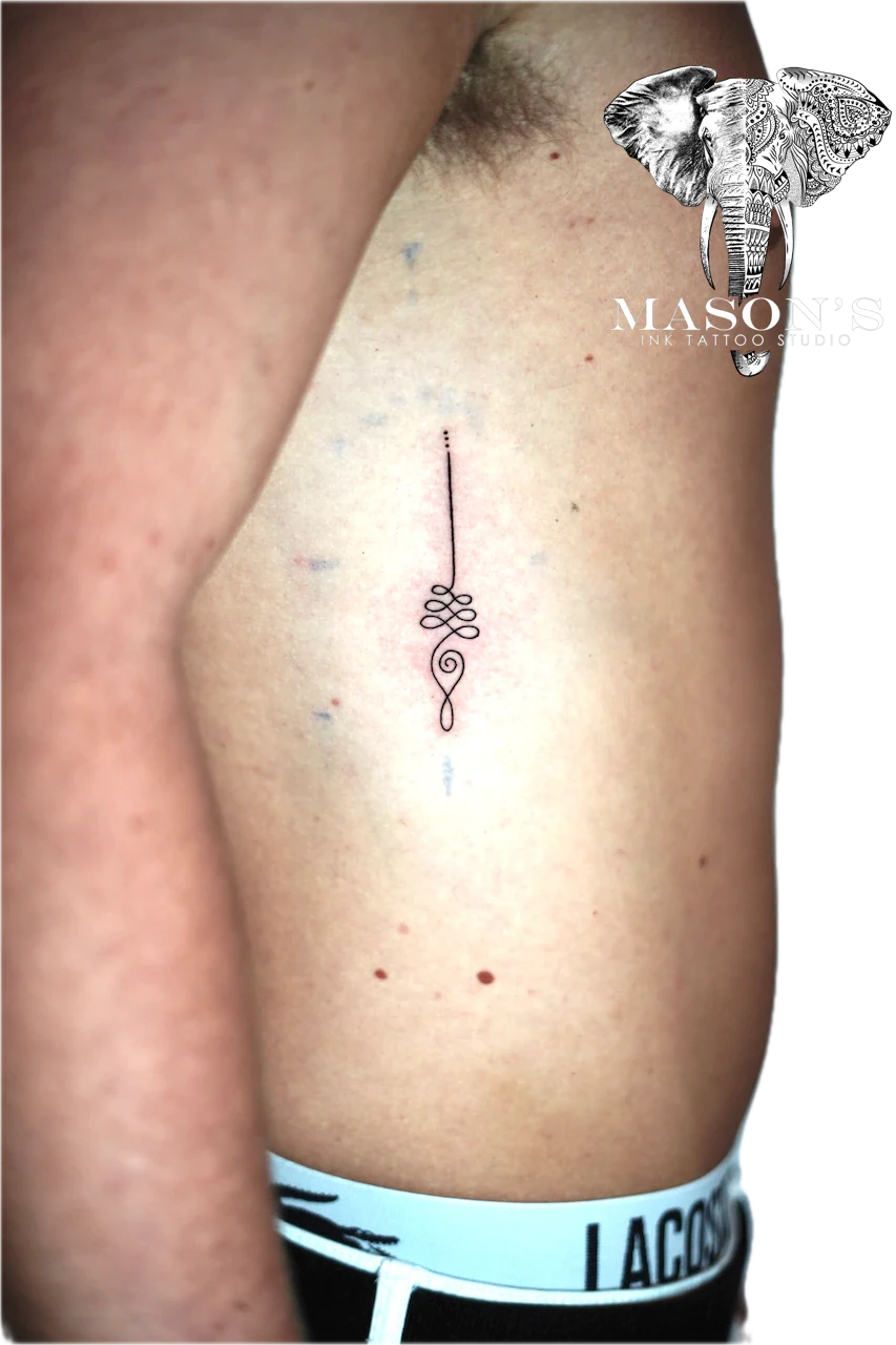 Fineline Tattoo Design: a small, minimalist swirl and line tattoo on the thigh