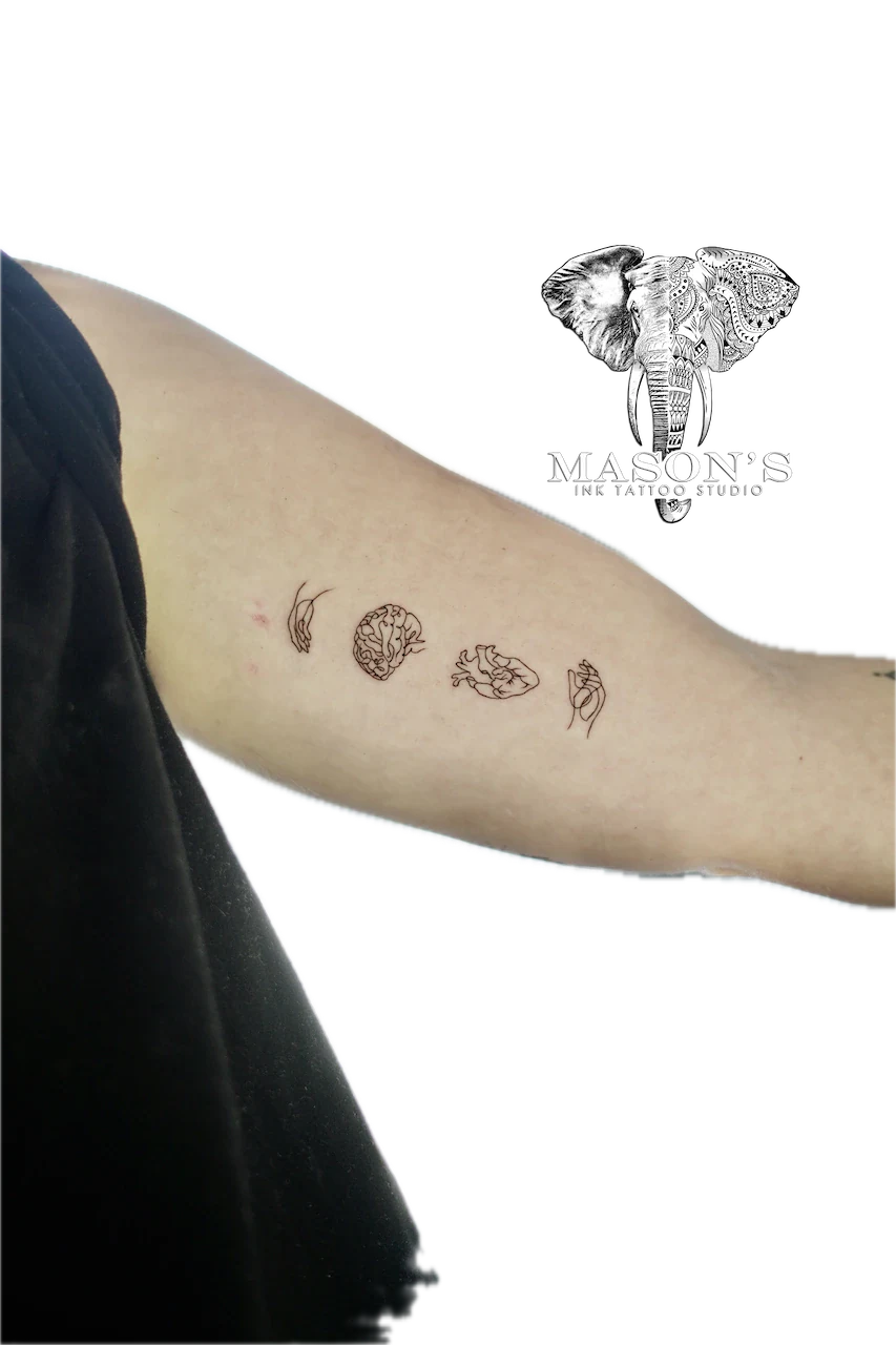 Minimalist Fine Line Tattoo Design: Small minimalist forearm tattoo of a brain, heart, leaf, feather, and wave