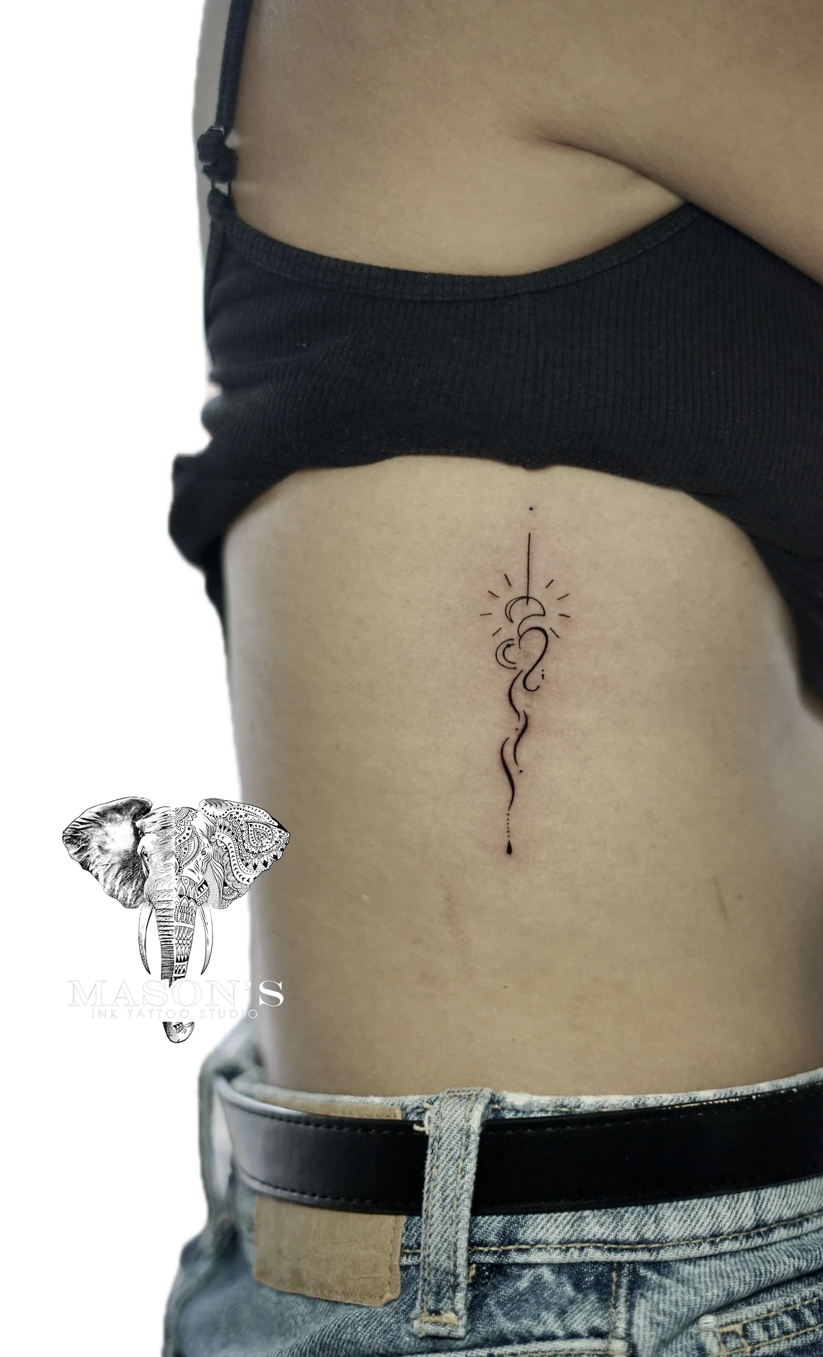 Fine Line Hearth Sun tattoo by Mason's Ink Tattoo Studio, Bali