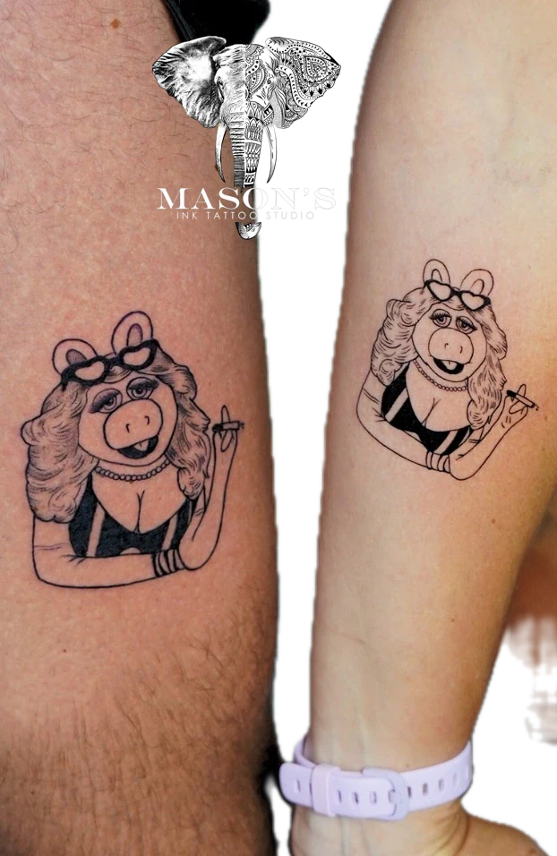 Miss Piggy from The Muppet Show holding ciragettee perfect couple tattoo by Mason's Ink Tattoo Studio, Bali