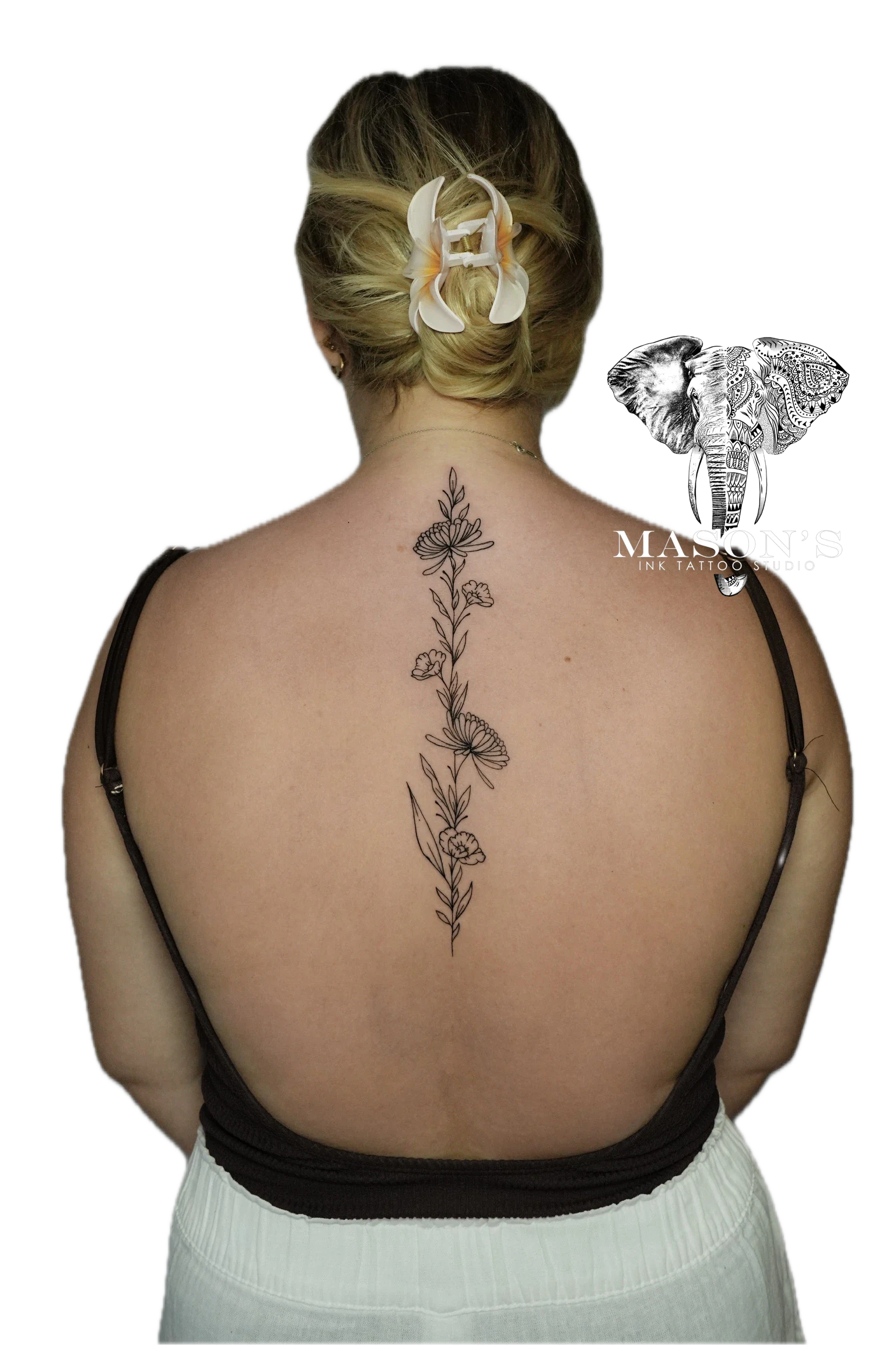 Floral Tattoo Style Design: a delicate floral vine with butterflies on a woman's spine