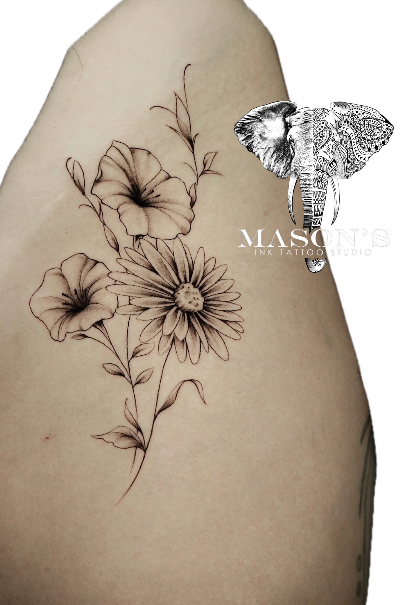 Floral Tattoo Style Design: a black and grey floral tattoo with an elephant ring