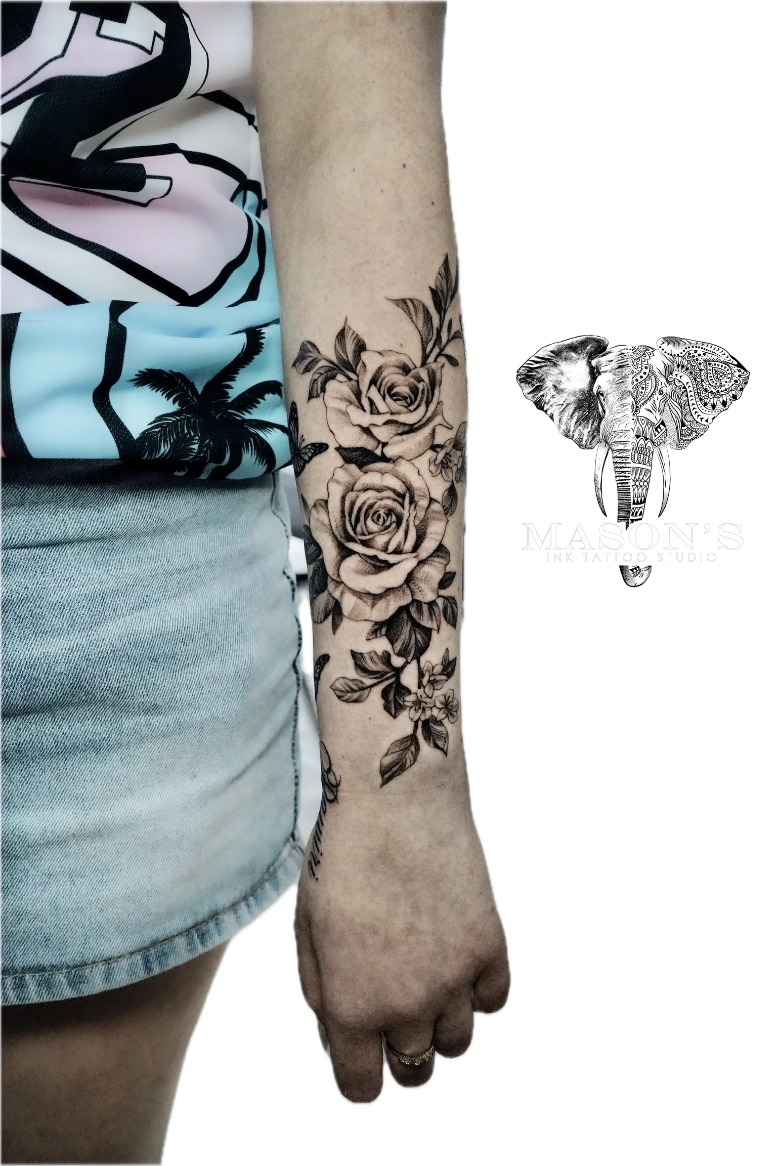 Floral Tattoo Style Design: a large black and grey floral tattoo on the forearm
