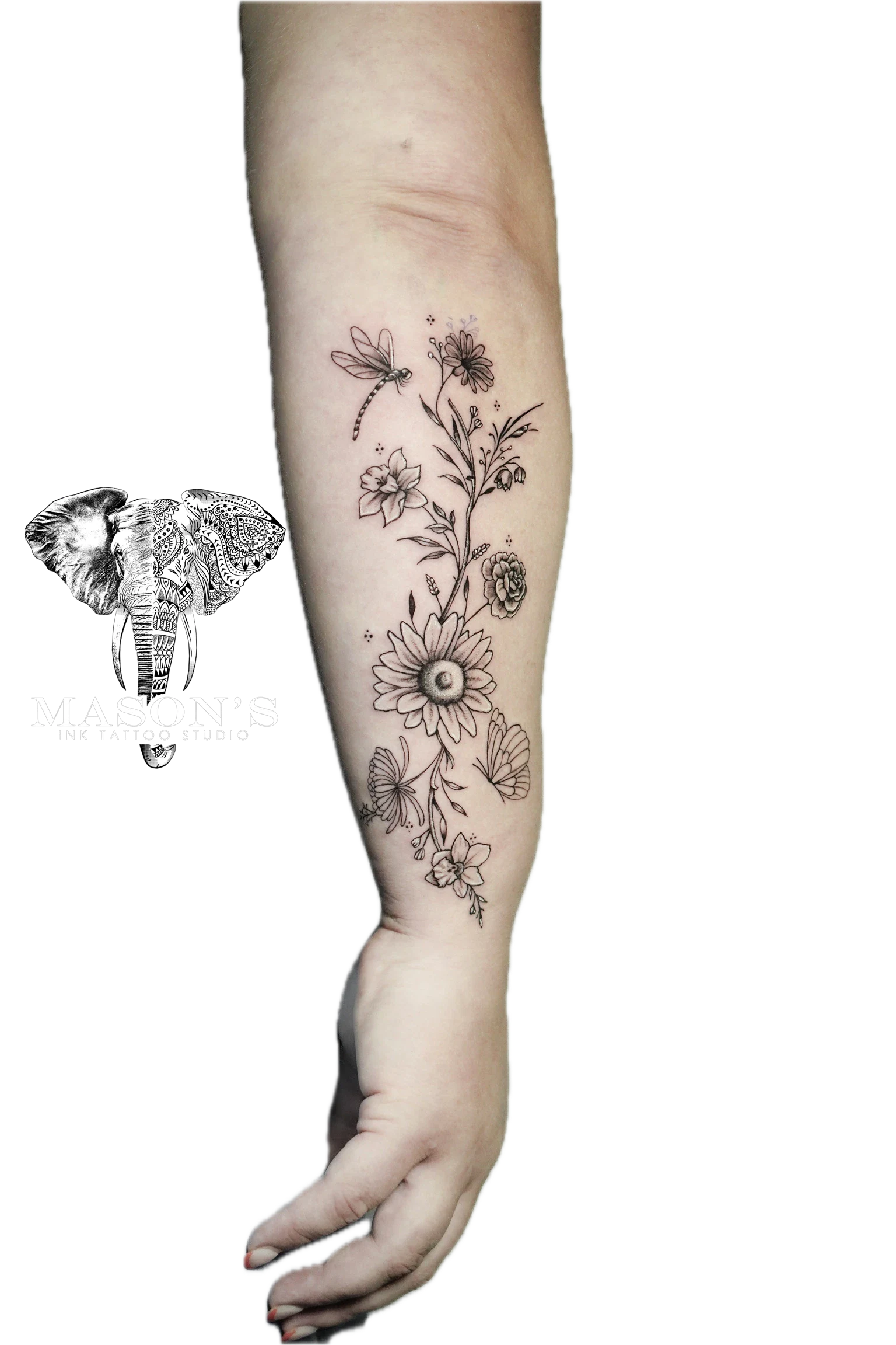 Floral Tattoo Style Design: a delicate floral tattoo with dragonflies and butterflies on a calf