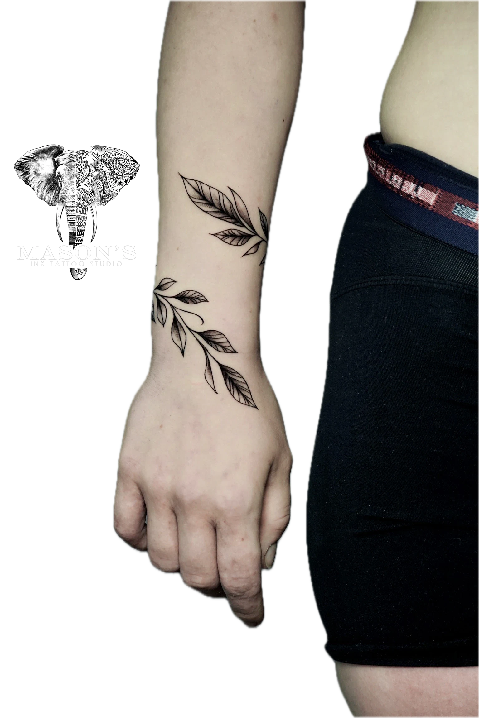Floral Tattoo Style Design: Minimal black and grey leaf and branch forearm tattoo