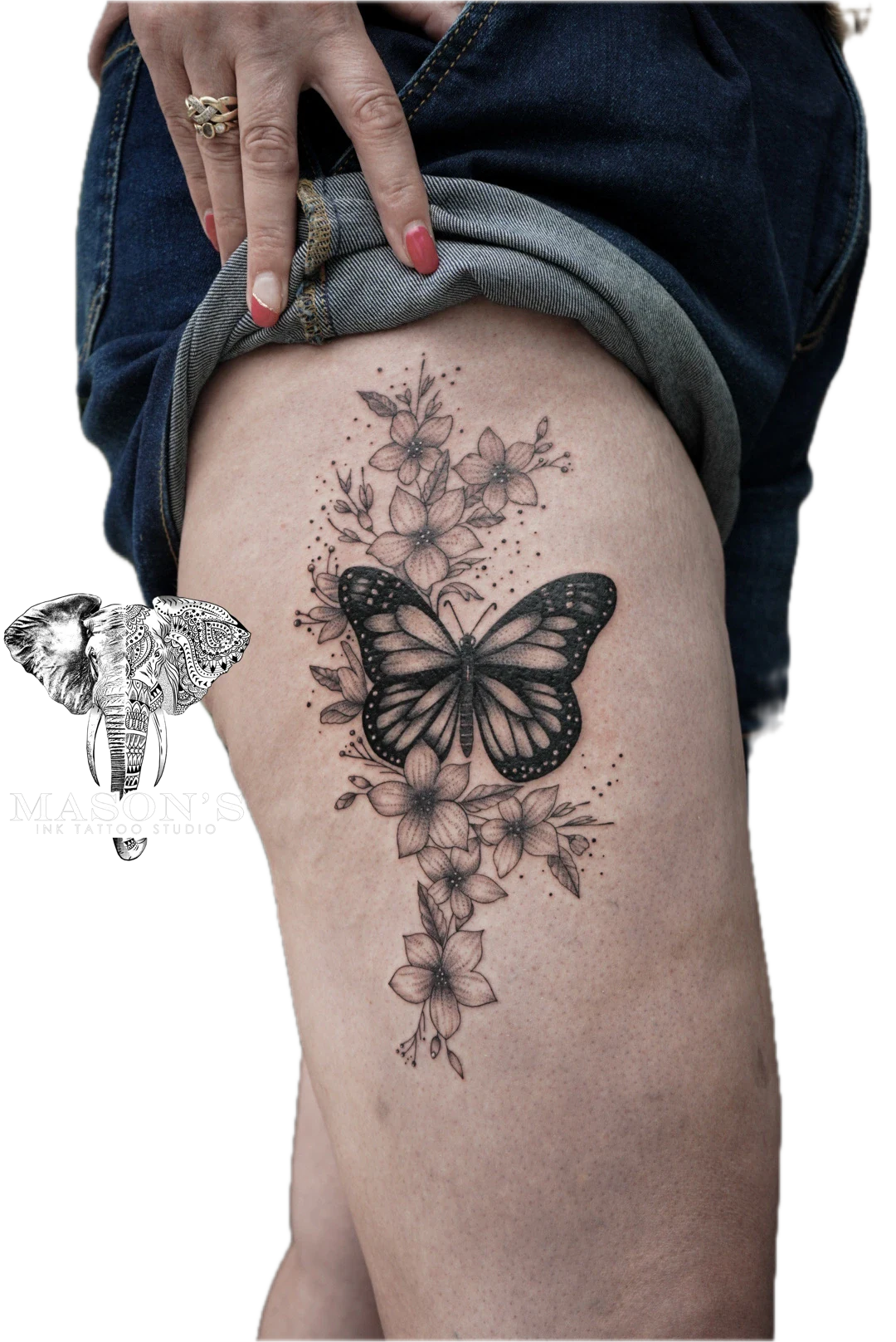 Floral with Butterfly Line Work Tattoo Style Design: a butterfly and flowers with leaves and dots on a thigh