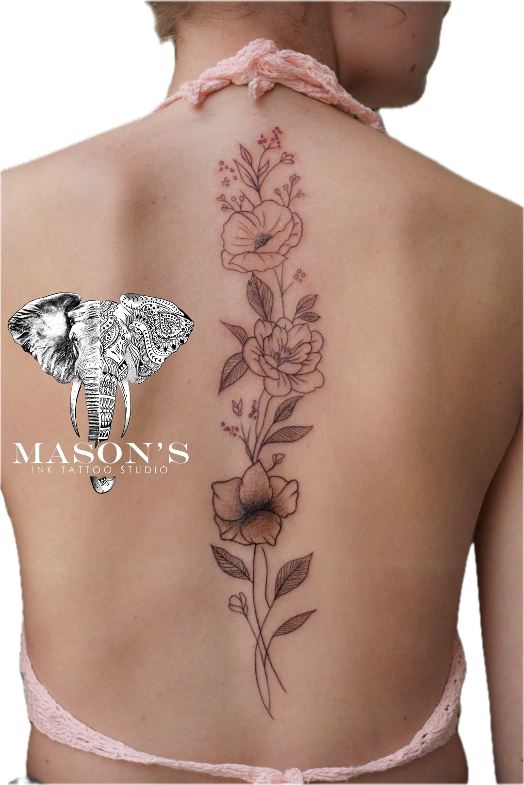 Floral Line Work Tattoo Style Design: a large floral design with an elephant mandala on the back