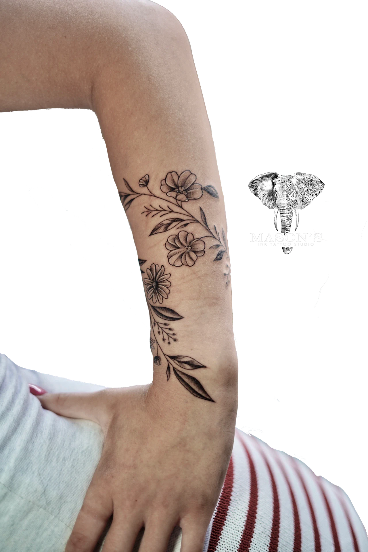 Flower Floral Tattoo Design: a delicate floral design on the forearm