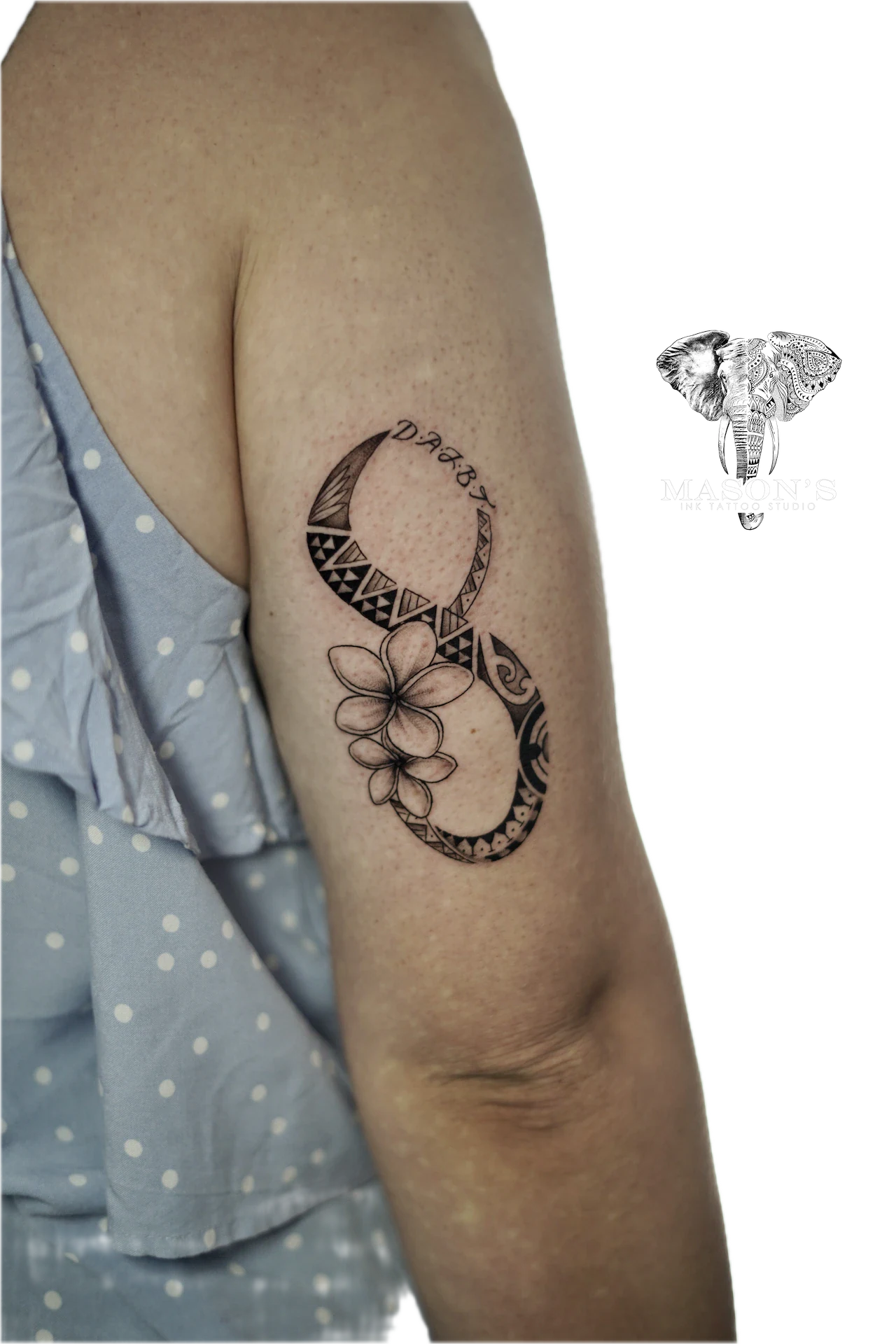Polynesian Floral Tattoo Design: a small black and grey moon and flower mandala with geometric patterns