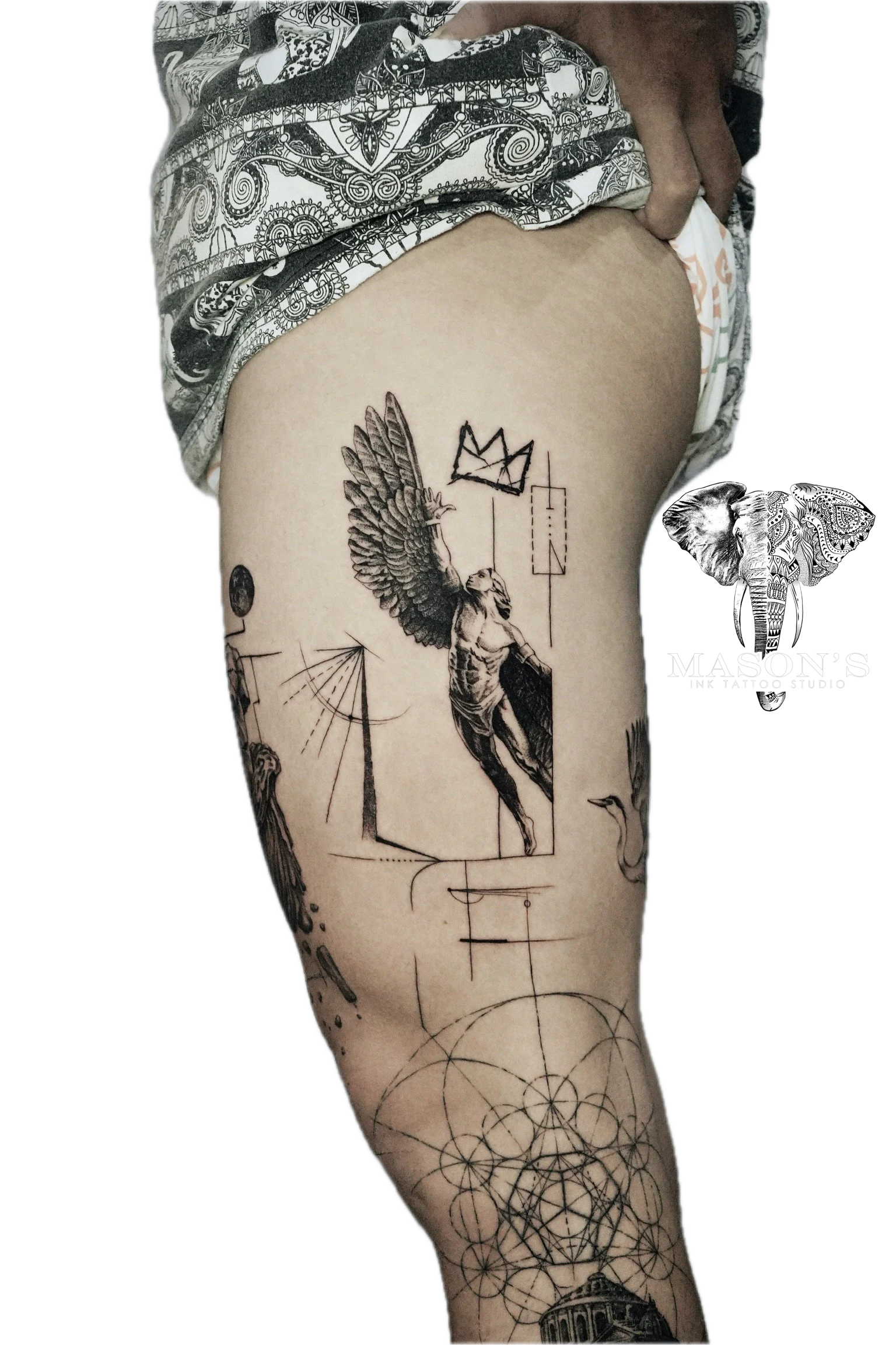 Geometric Conceptual Tattoo Style Angel Design: a large black and grey thigh tattoo of an angel with a crown
