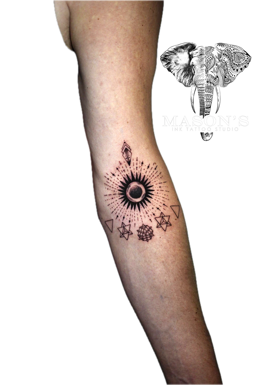 Geometric Tattoo Design: a minimal geometric pattern with a sun and geometric shapes on the forearm