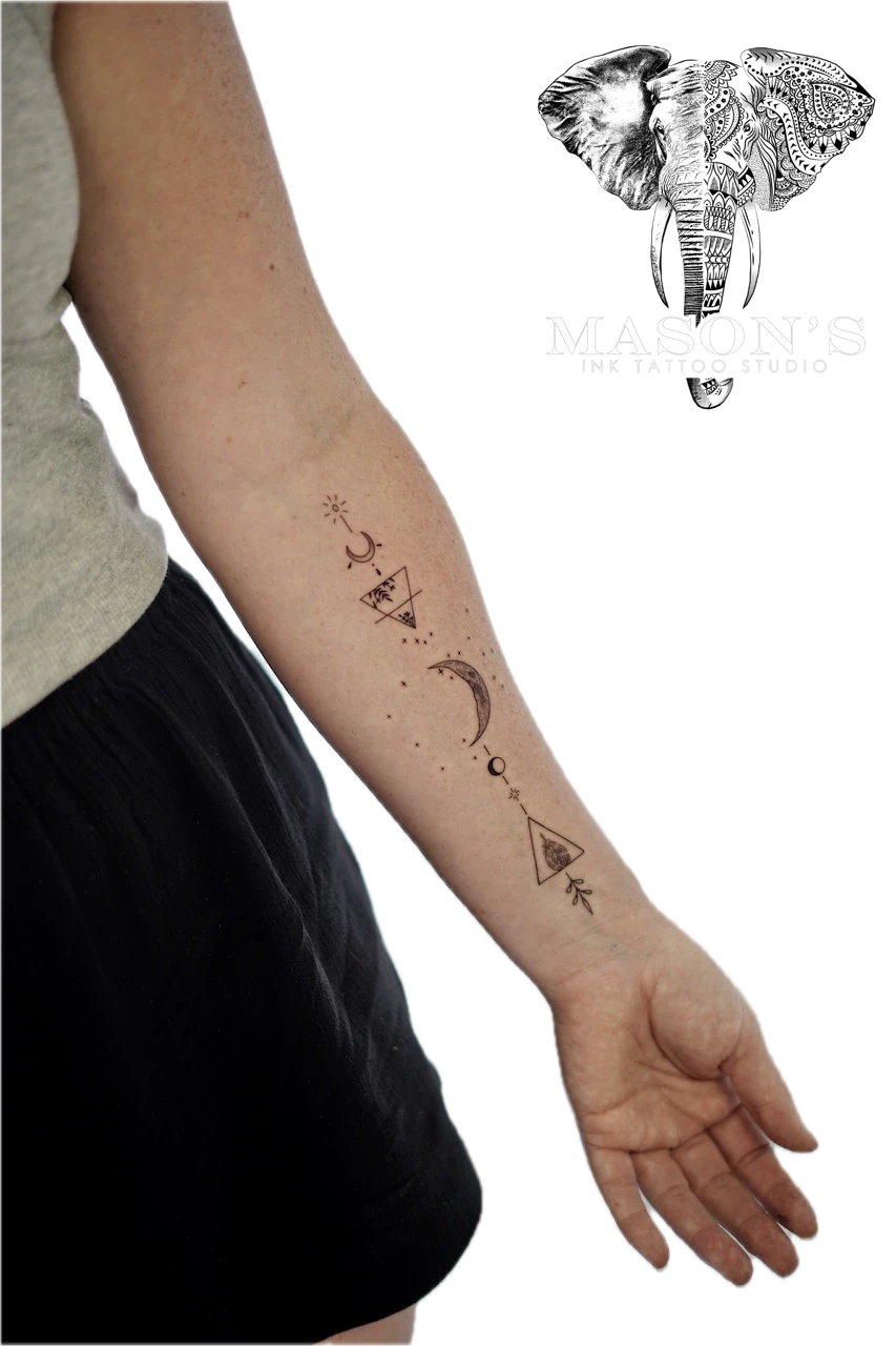 Geometric Tattoo Design: Minimal geometric pattern with moon and stars on the forearm