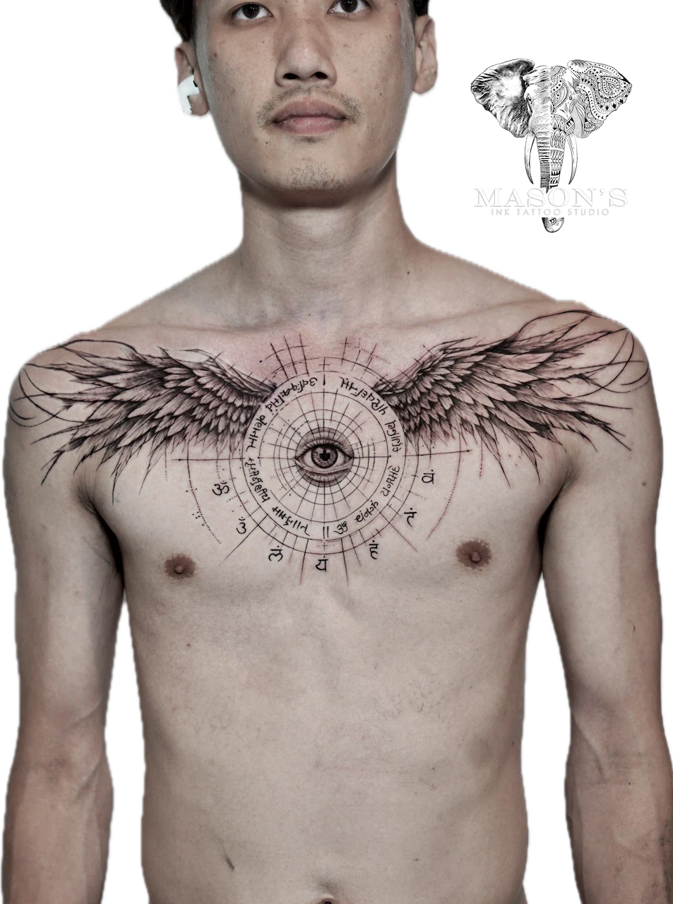 Geometry Om Script Eye and Wings Tattoo Design: a large chest tattoo of an eye with wings and a mandala pattern