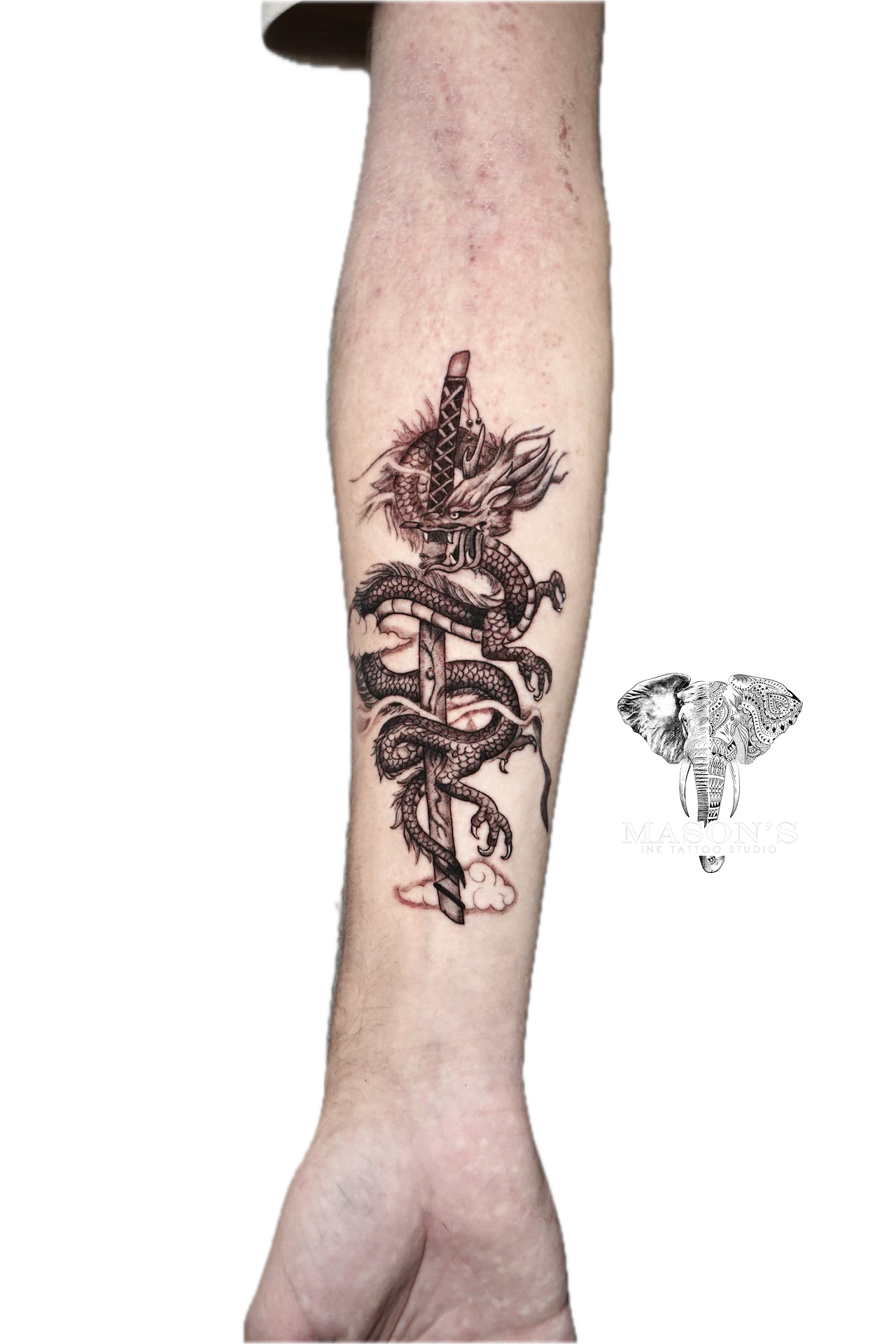 Japanese Dragon Tattoo Design: a detailed dragon wrapping around a sword on a forearm