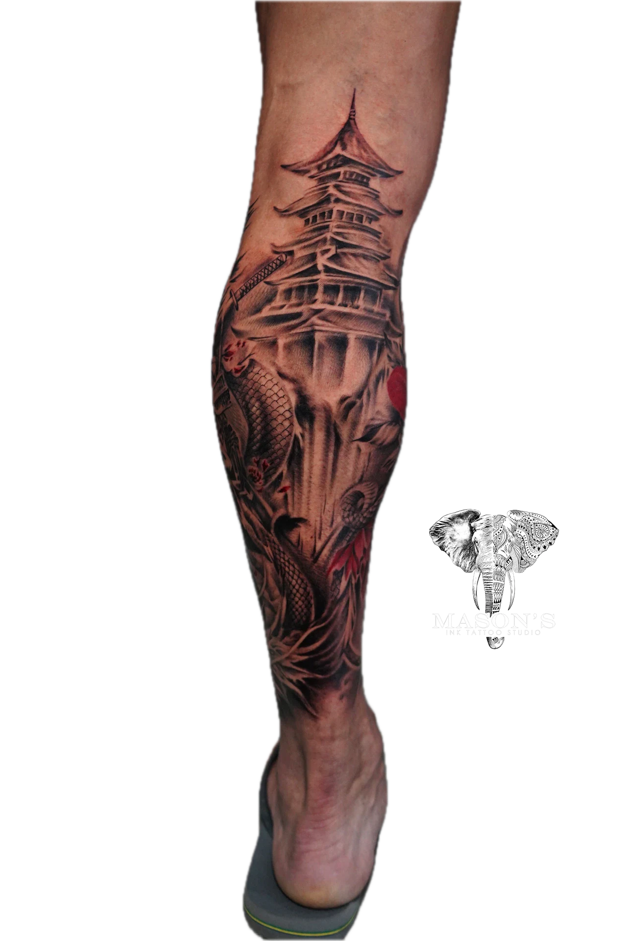 Japanese Temple Tattoo Design: a detailed black and grey Japanese castle and dragon leg tattoo