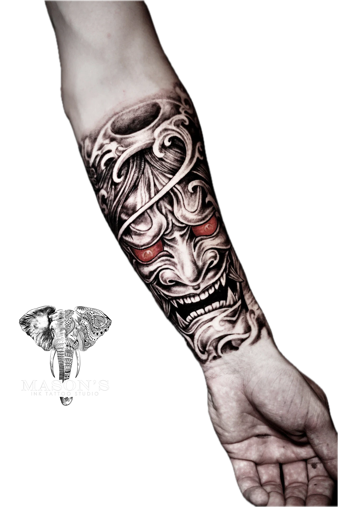 Japanese Style Tattoo Design: a detailed forearm tattoo of a mythological face with intricate patterns