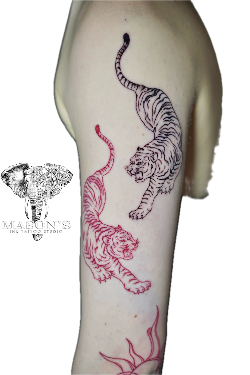 Japanese Tiger Tattoo Design: Two tigers with flames on an upper arm