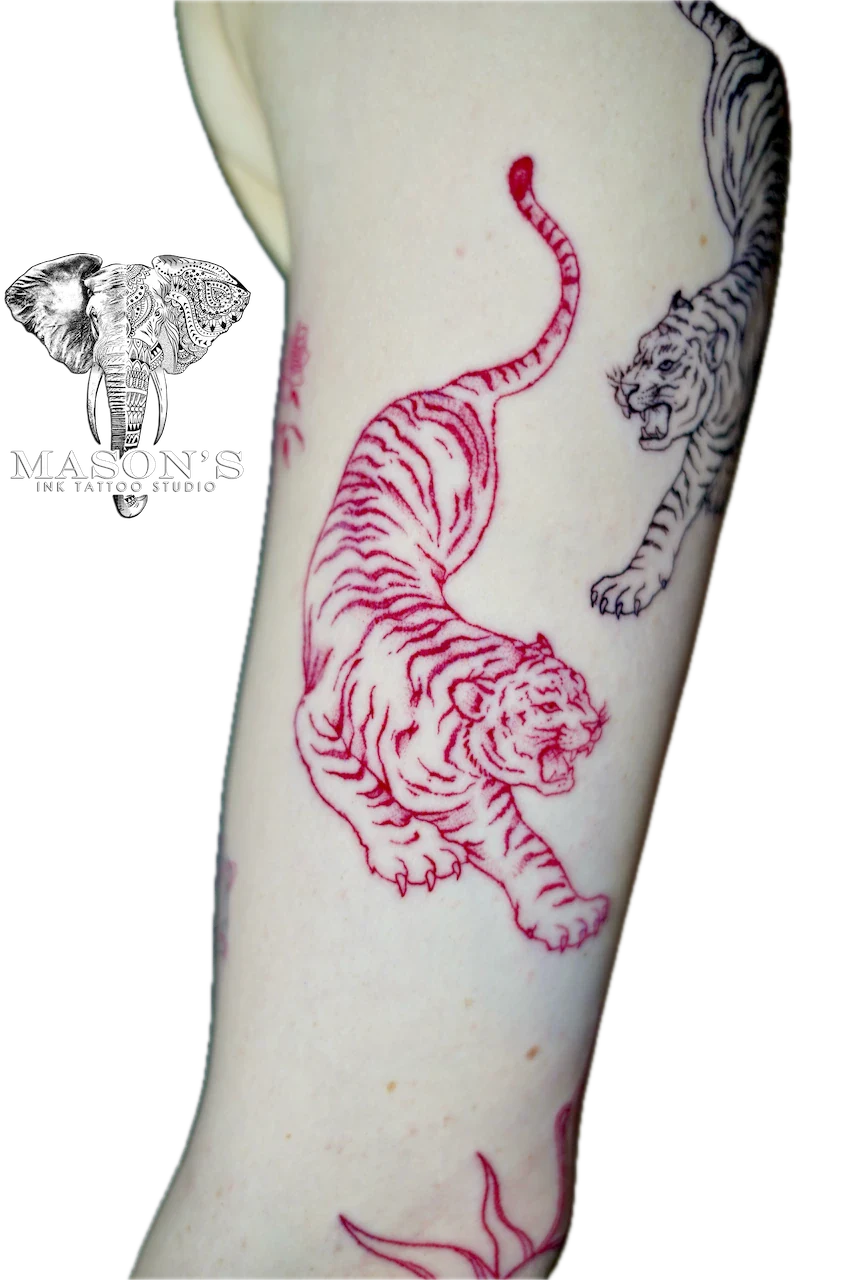 Japanese Tiger Tattoo Design: Two tigers in red and black on a calf