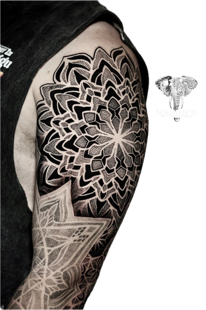 Mandala Arm Tattoo Design: a large black and grey mandala geometric pattern on the upper arm