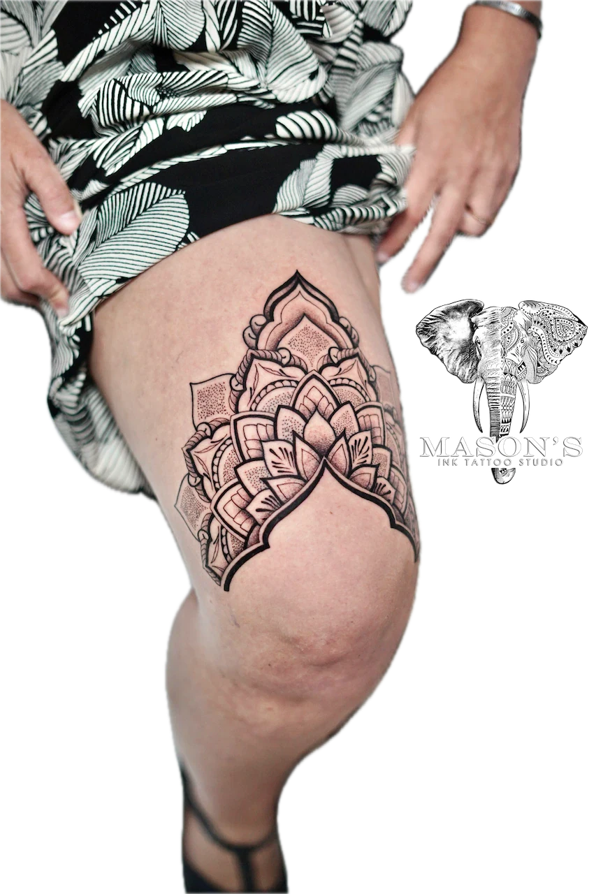 Mandala Tattoo Design: a large black and grey mandala lotus flower on the thigh