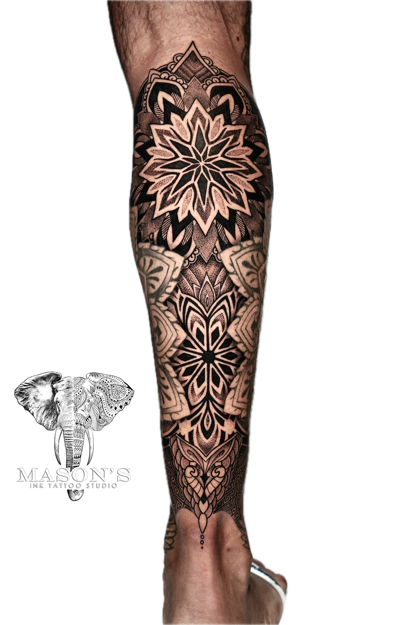 Mandala Tattoo Design: a large black and grey mandala and geometric pattern on a full leg