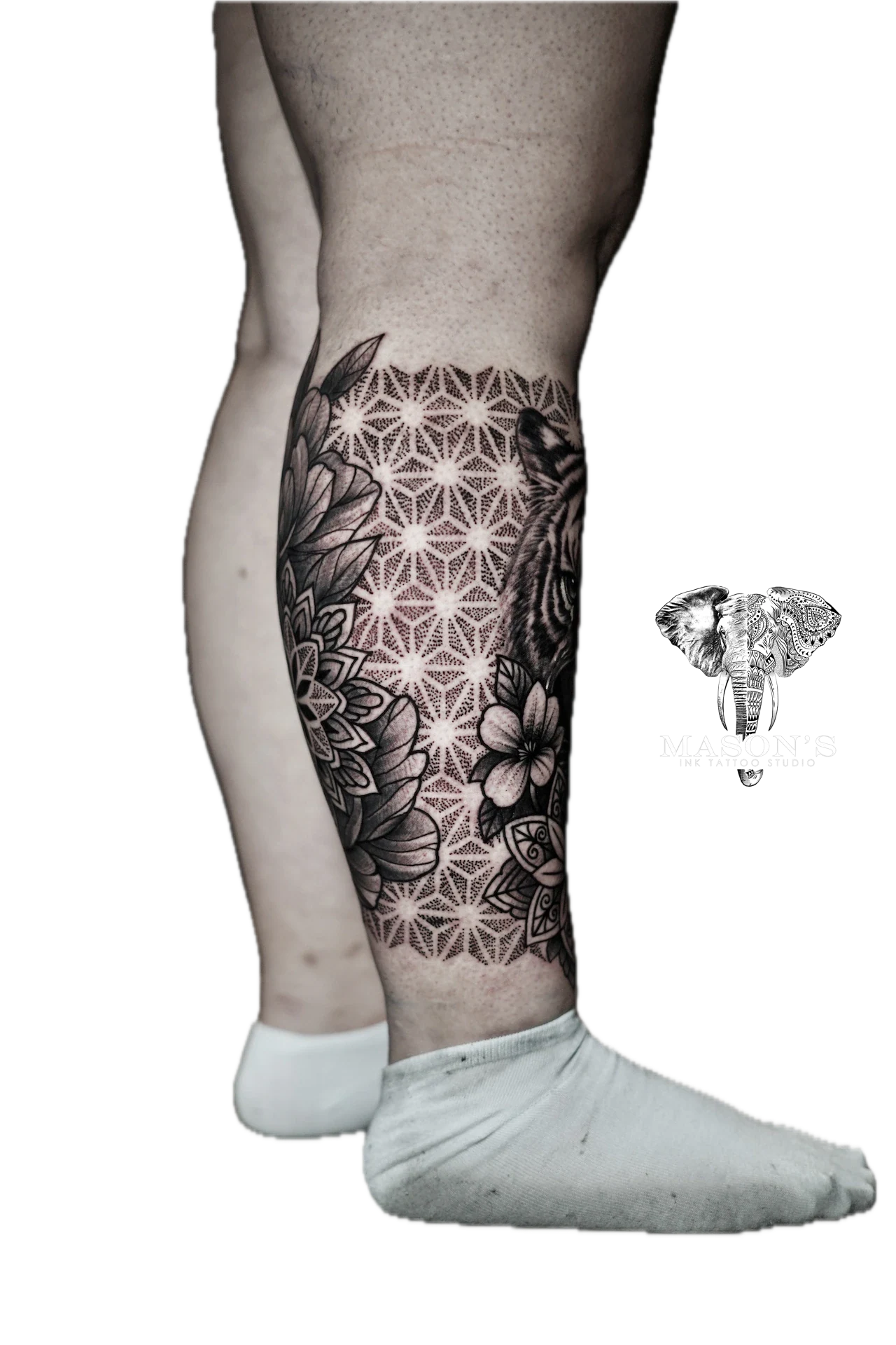 Mandala Calf Tattoo Design: Intricate geometric pattern and floral design on the calf