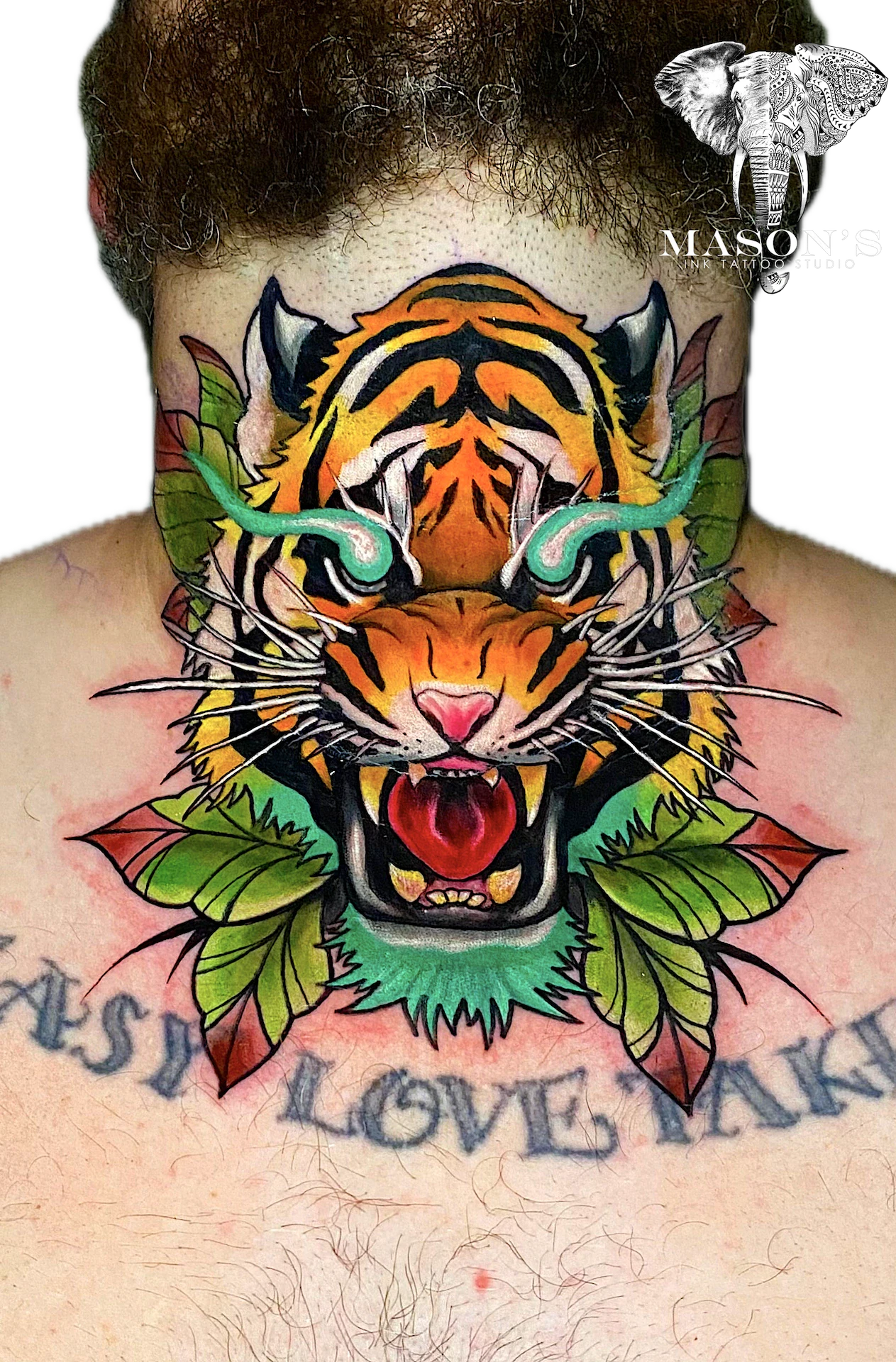 Neo-Traditional Tiger Tattoo Design: a roaring tiger with leaves and lettering on the sternum