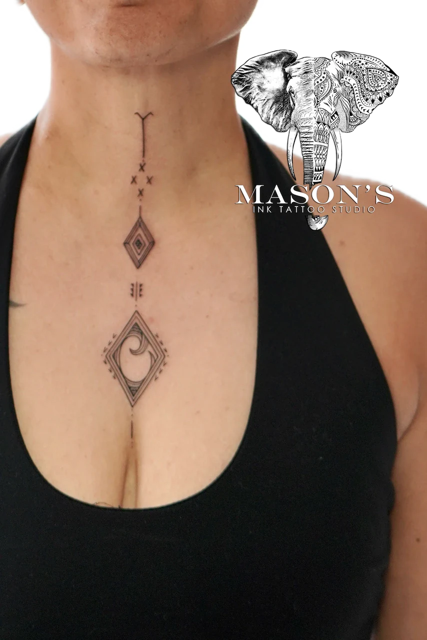 Ornamental Tattoo Design: Minimal geometric pattern with moon symbols on sternum