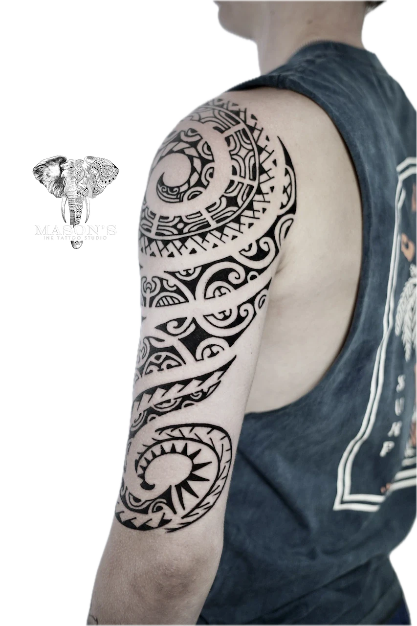 Polynesian Tattoo Design: Intricate geometric pattern with moon and sun on upper arm