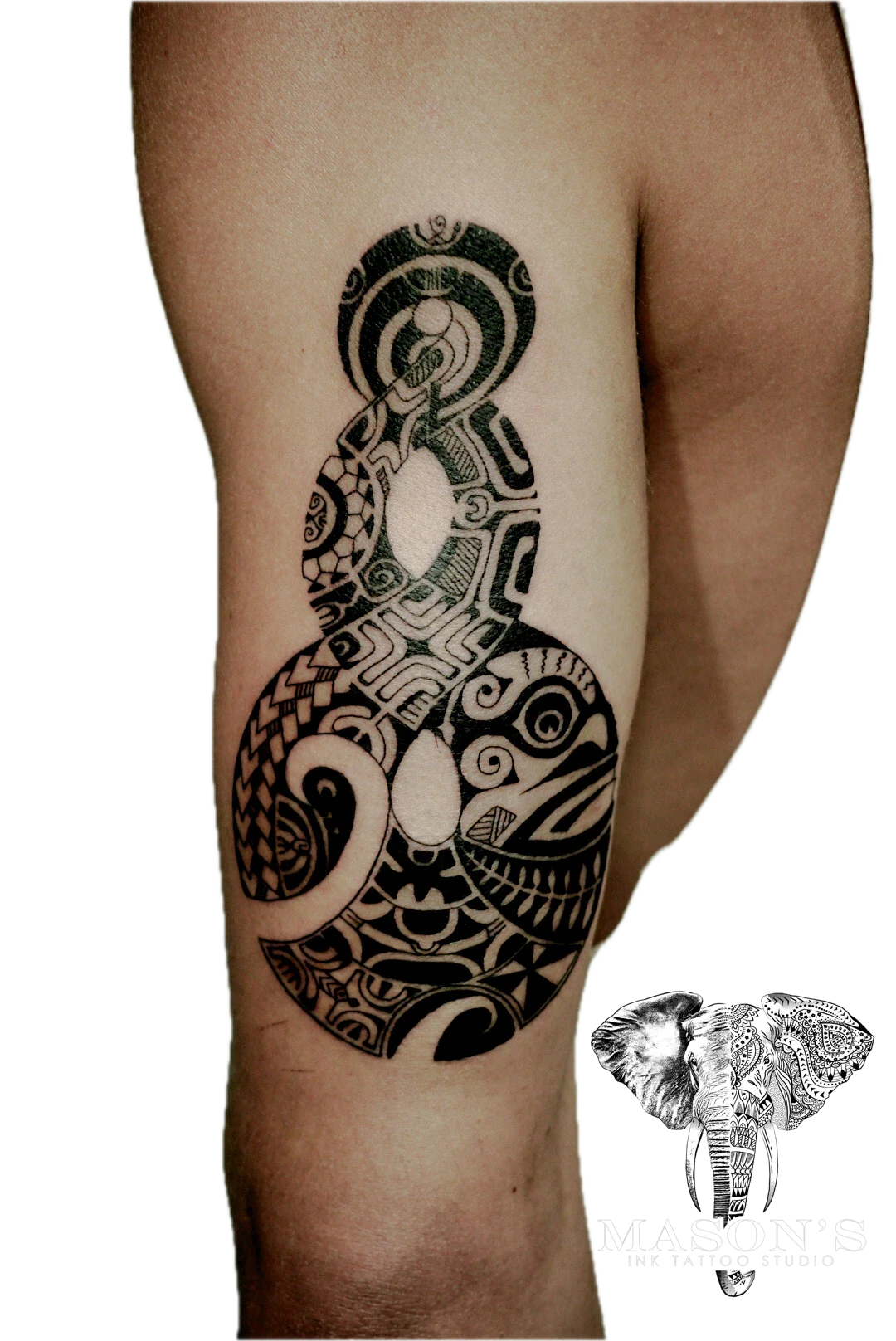 Polynesian Tattoo Design: a large black and grey geometric pattern on a calf