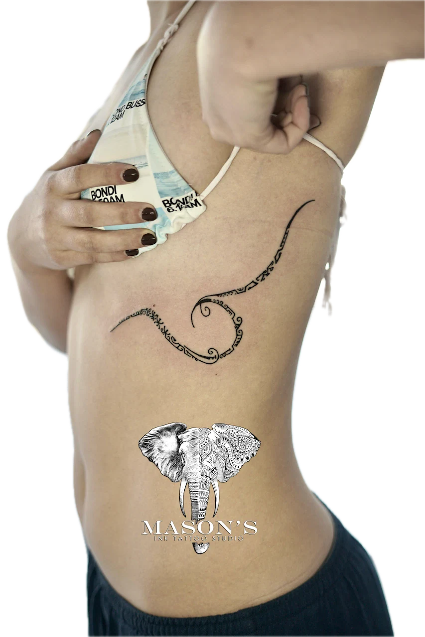 Polynesian Tattoo Design: an elephant with mandala patterns and swirls on the back