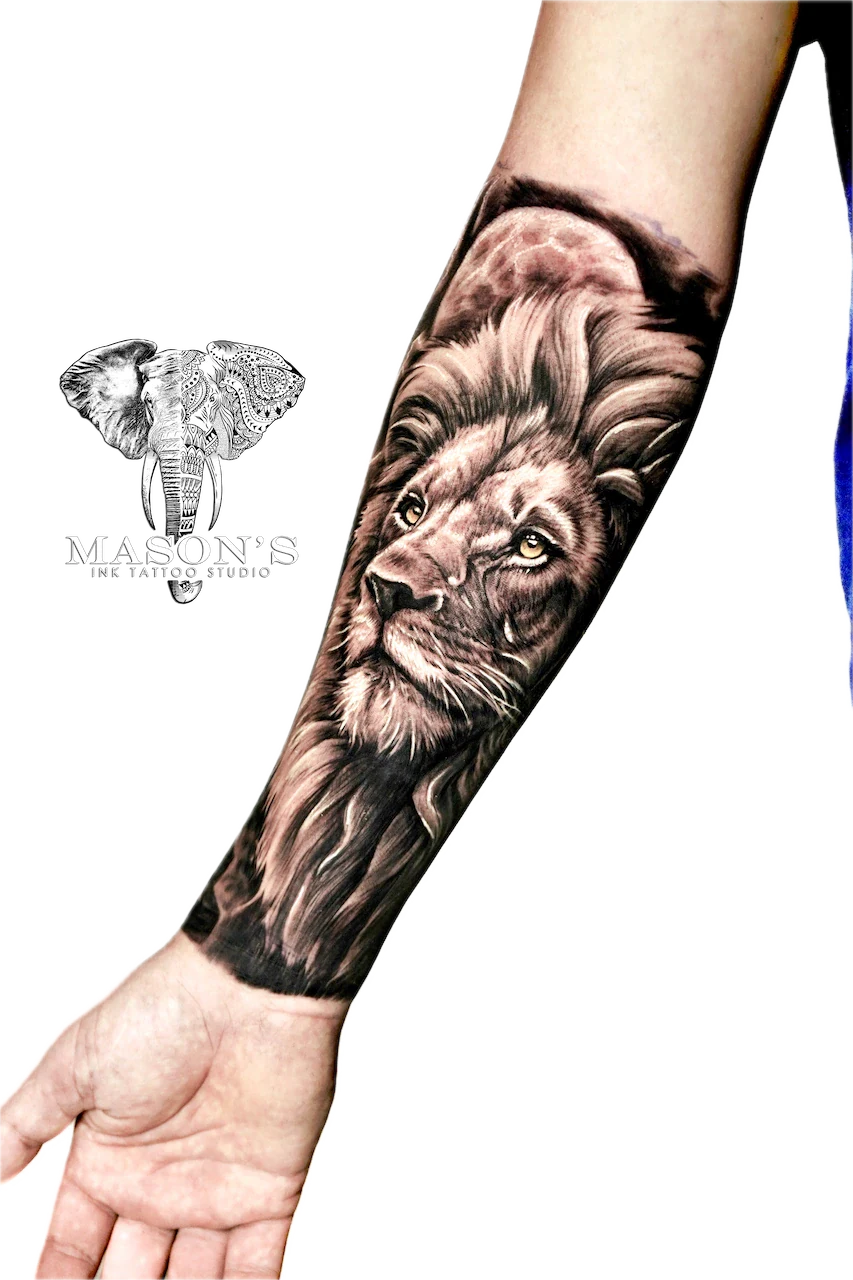 Realism Lion Tattoo Design: a detailed lion portrait tattoo on a forearm