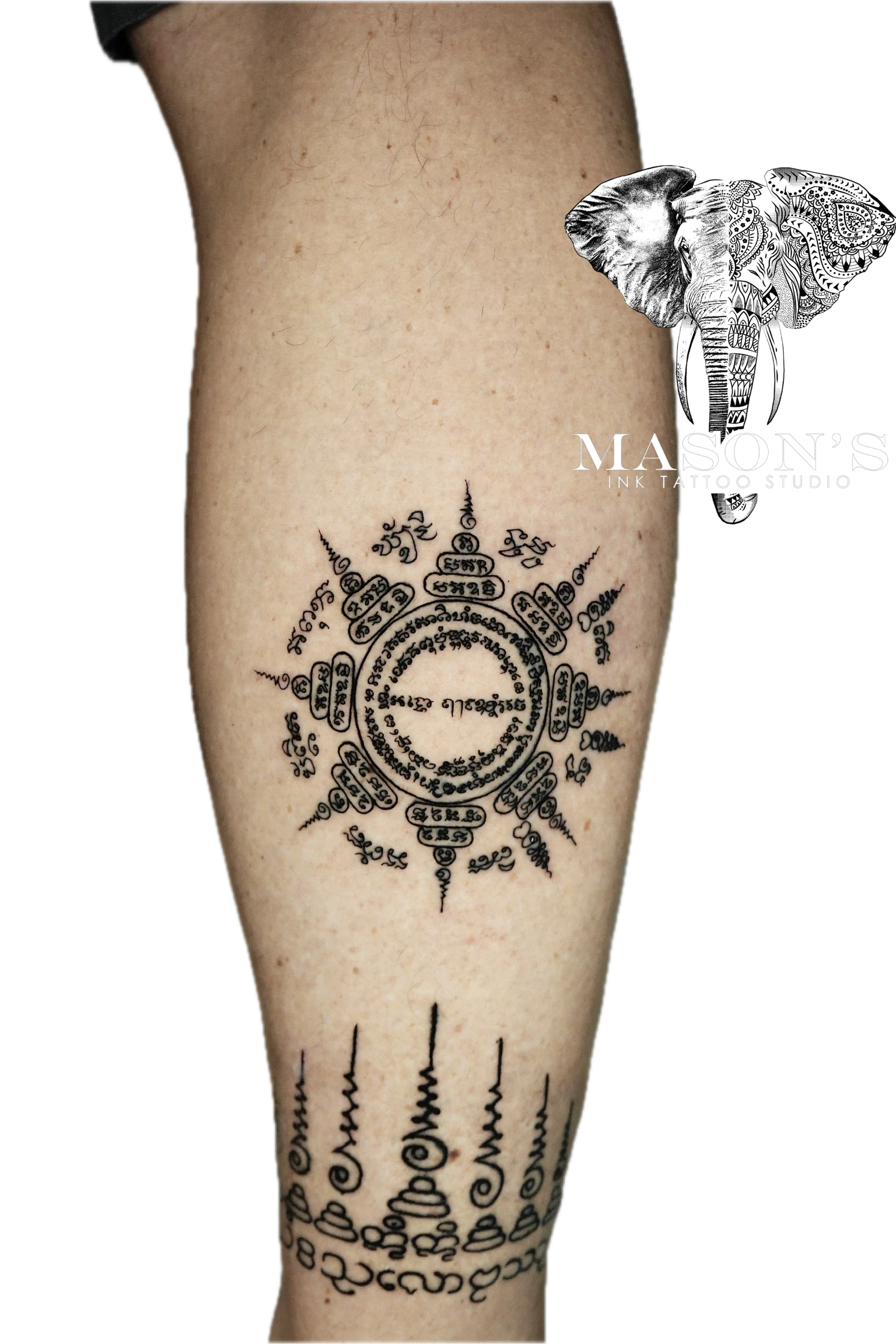 Sak Yant Tattoo Design: a detailed mandala with intricate lettering and geometric patterns on a calf