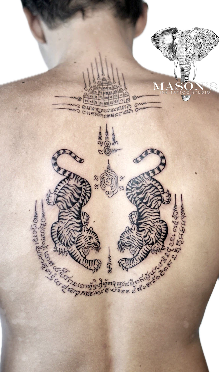 Sak Yant Tattoo Design: Two tigers and spiritual symbols on the back with lettering