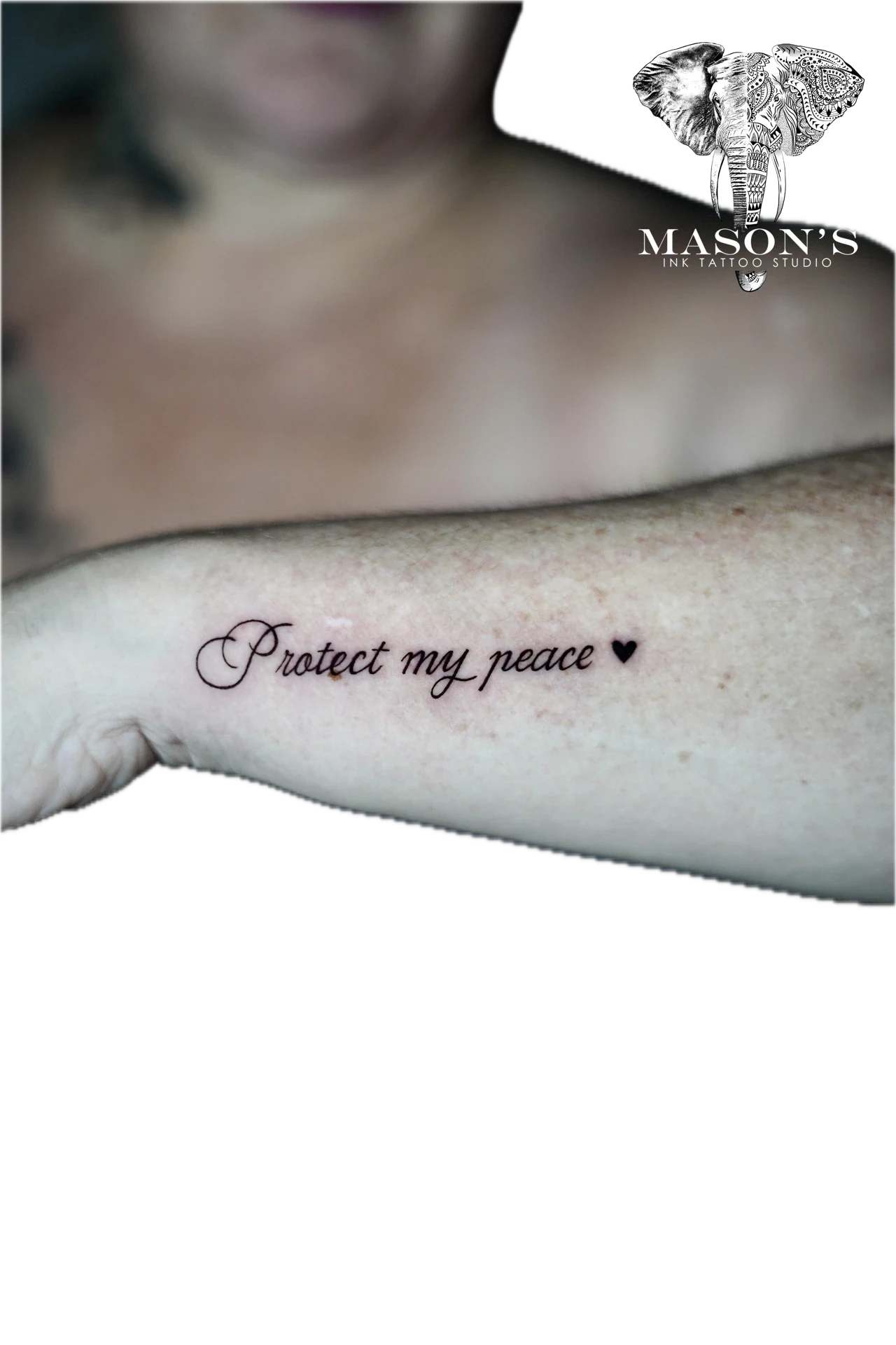 Script Protect My Peace Tattoo Design: a small forearm tattoo of the phrase 'Protect my peace' with a heart