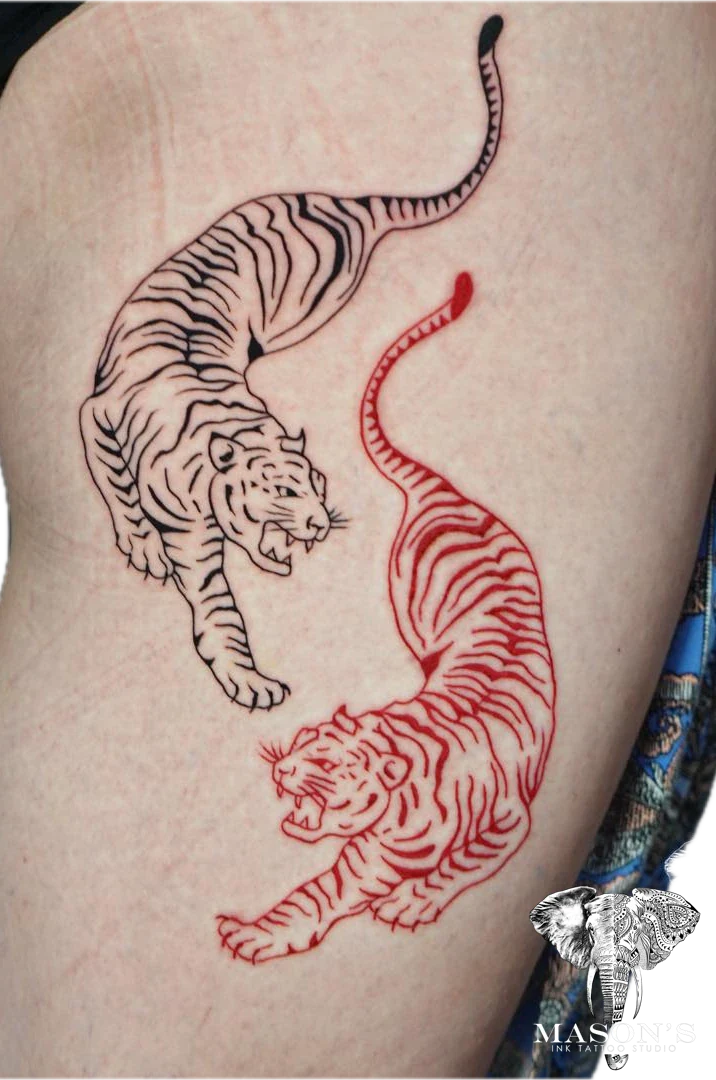 Traditional Twin Tiger tattoo by Mason's Ink Tattoo Studio, Bali
