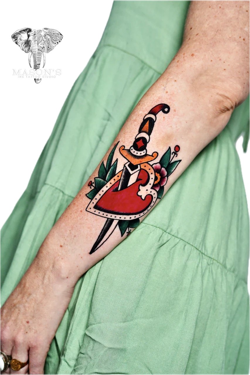 Traditional Love and Knife Tattoo by Mason’s Ink - Traditional tattoo by Mason's Ink Tattoo Studio, Bali