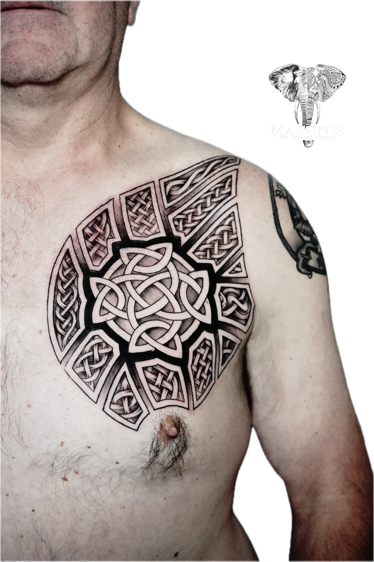 Tribal Tattoo Design: a large geometric knotwork pattern on the shoulder