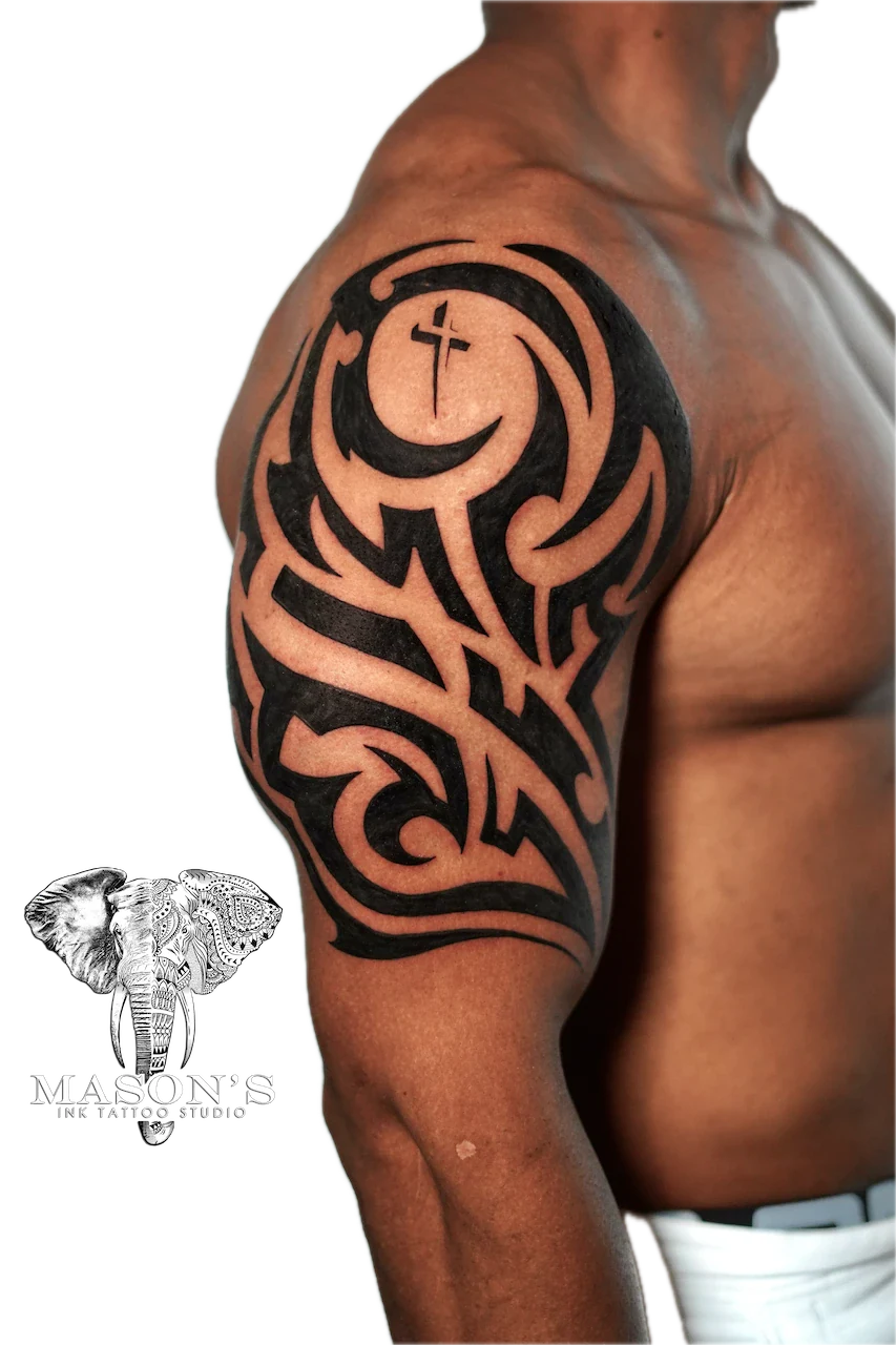 Tribal Tattoo Design: a large black and grey geometric pattern with a moon and cross on the upper arm
